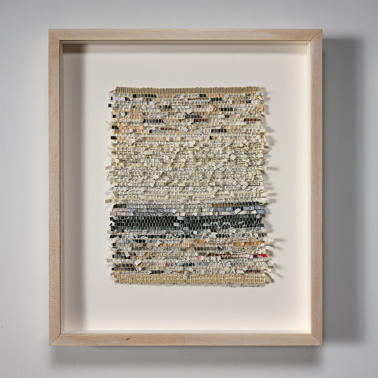 A picture of a piece of art hanging on a wall.