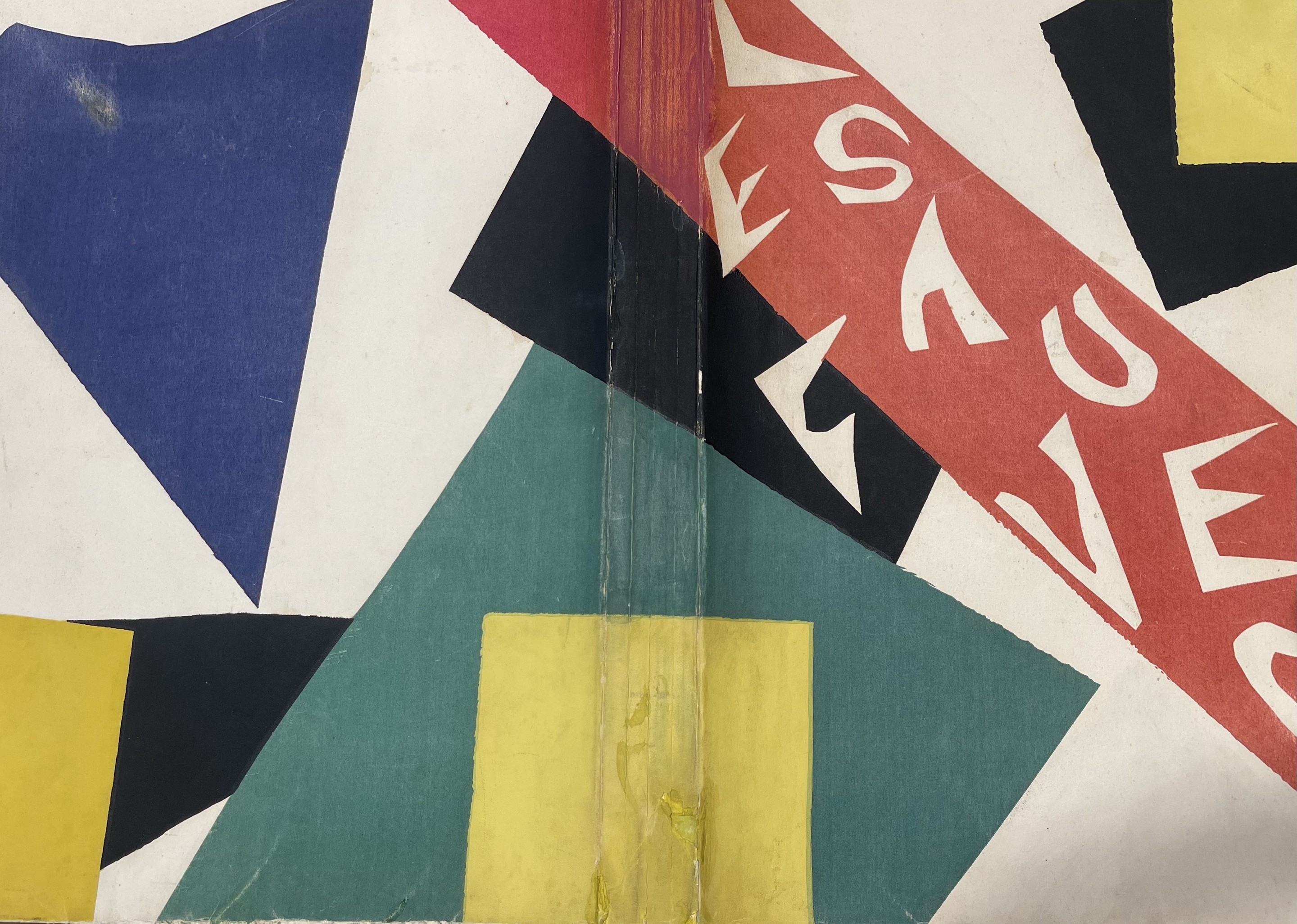 A person holding up a piece of paper with a painting on it.