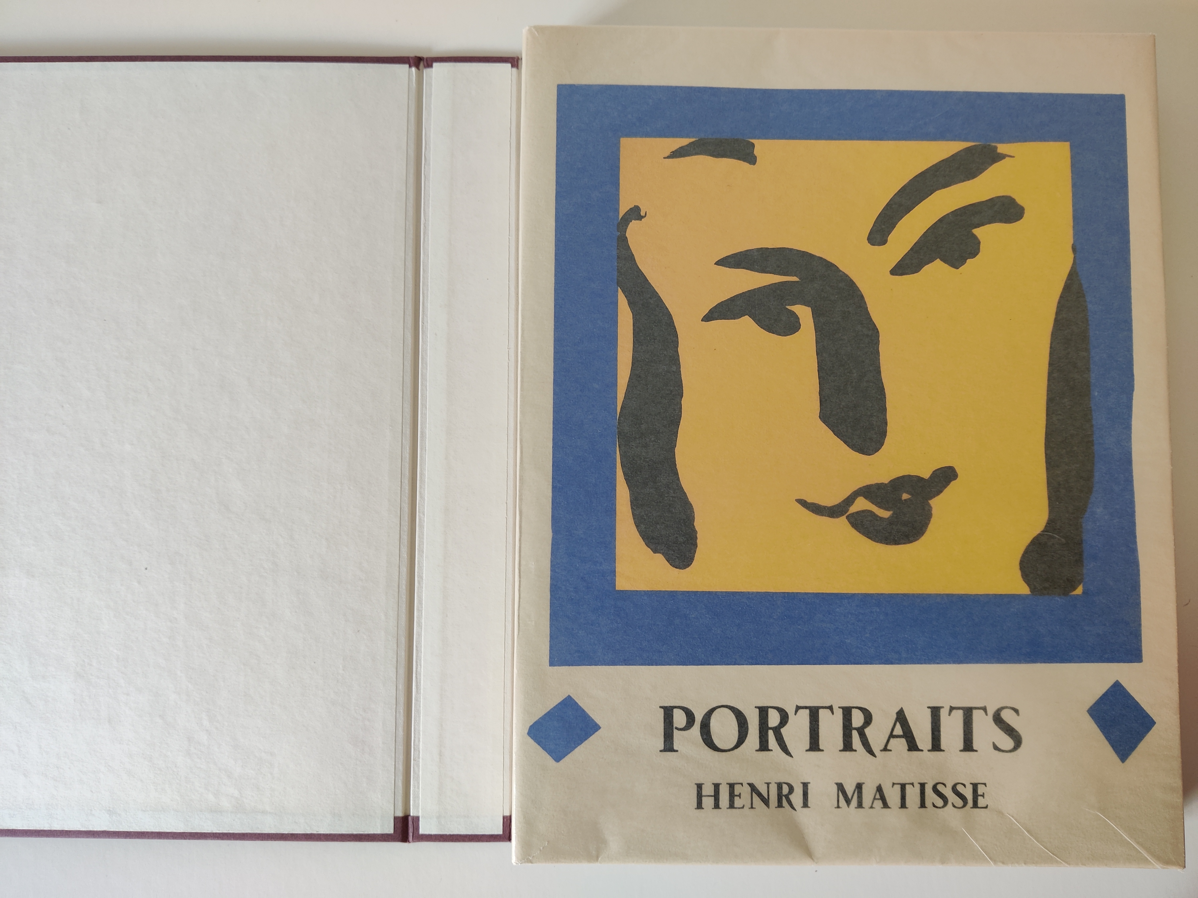 A graphic portrait book cover featuring a stylized face in bold colors.