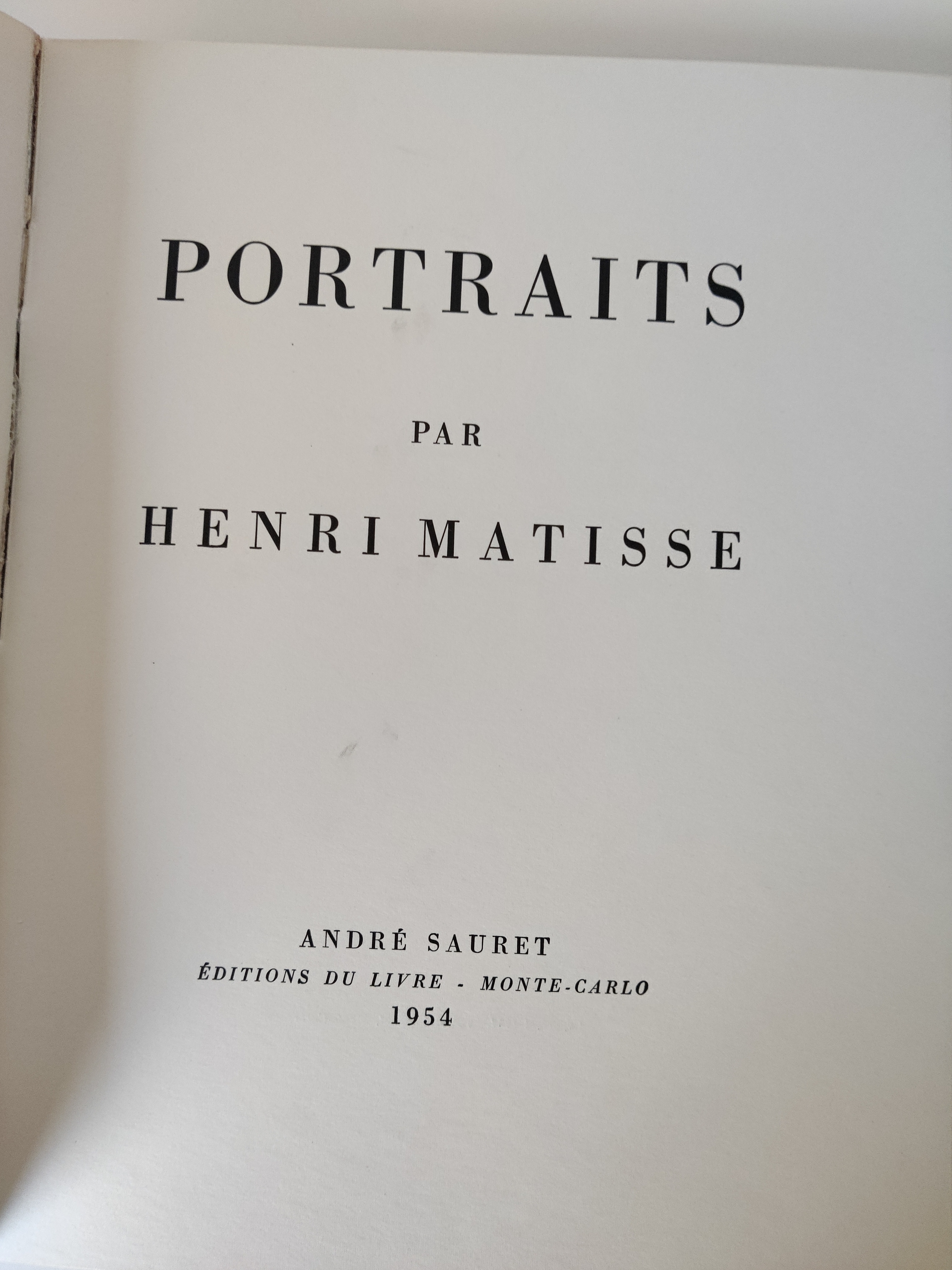 A graphic portrait book cover featuring a stylized face in bold colors.