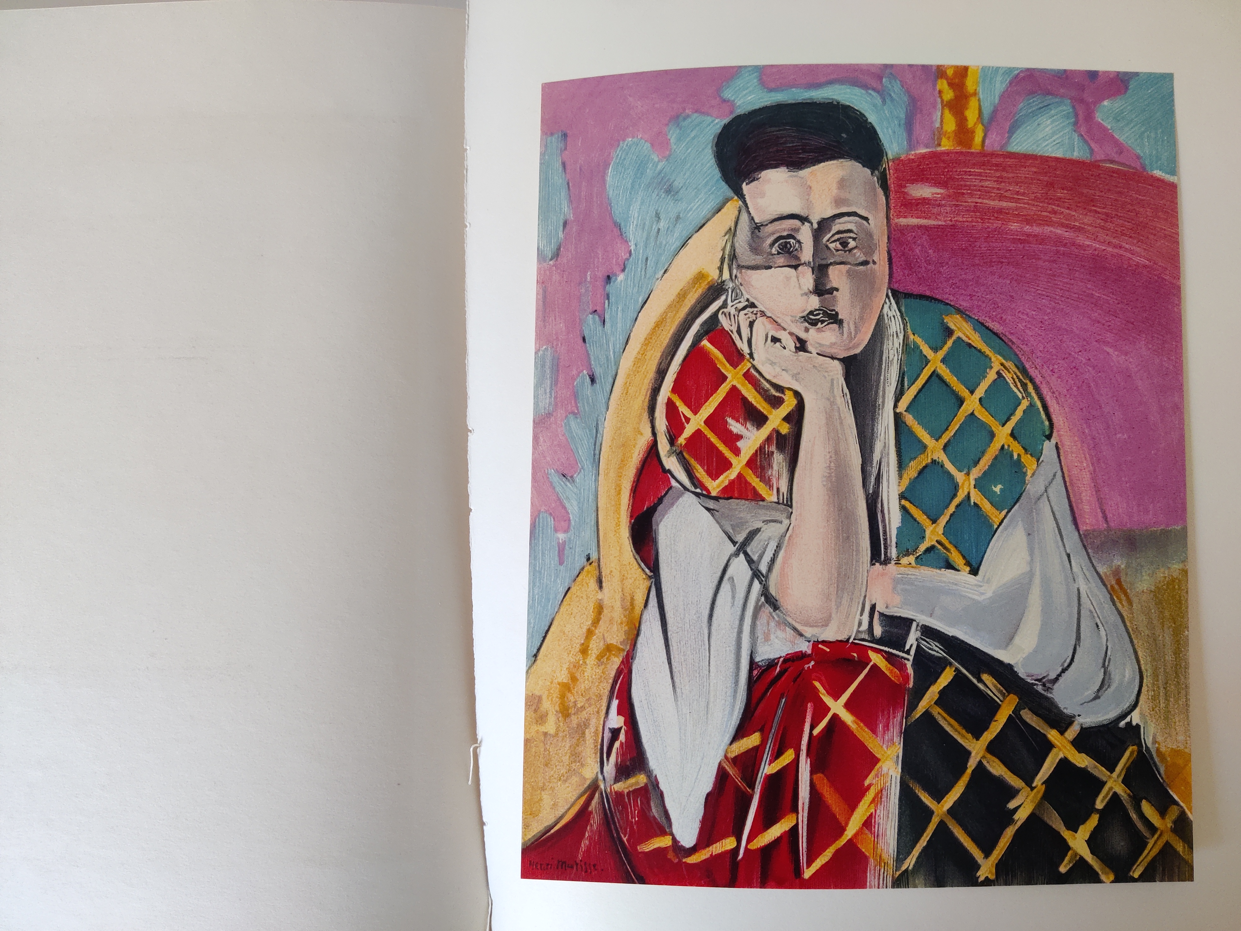 A graphic portrait book cover featuring a stylized face in bold colors.