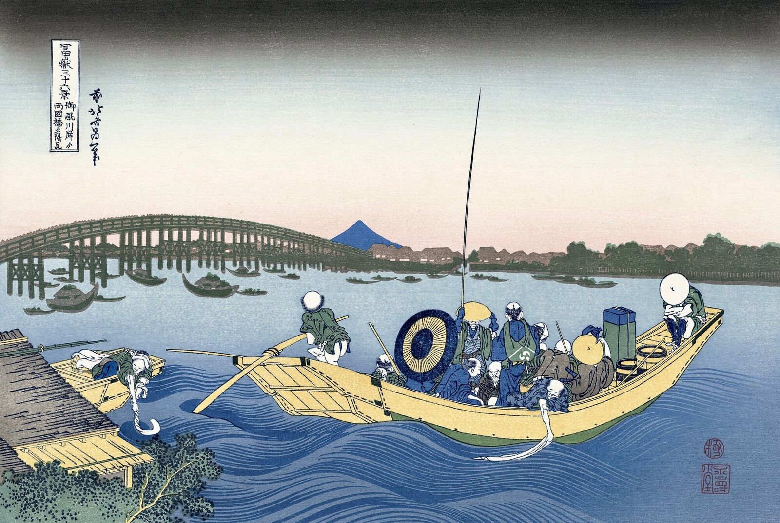 A group of people in a boat on a body of water.