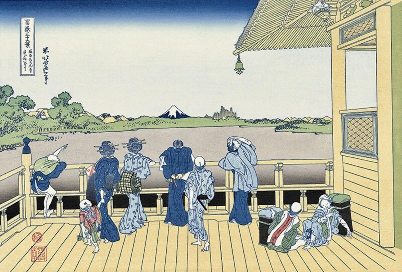 A group of people standing on a wooden deck.