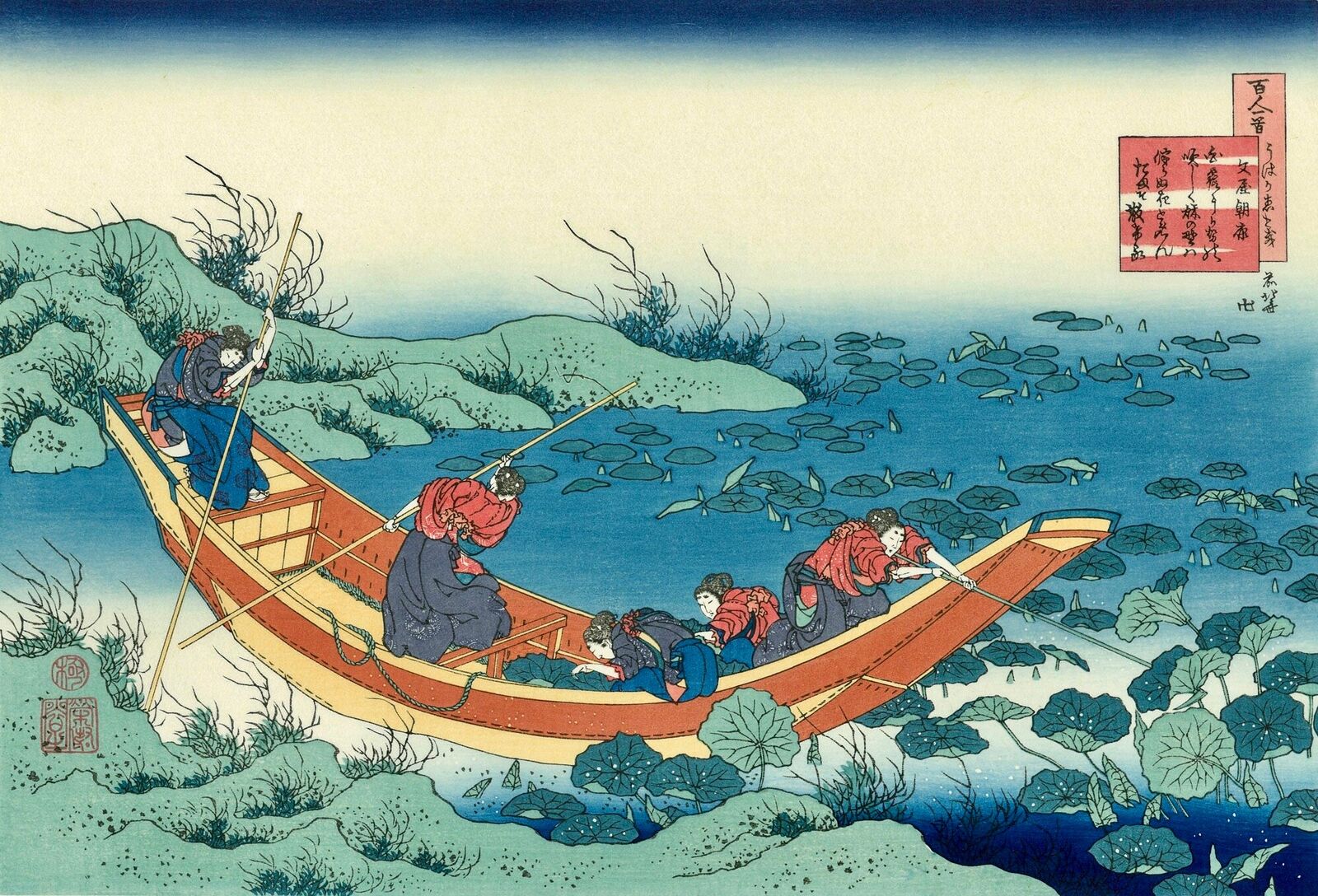 A group of people in a boat on a body of water.