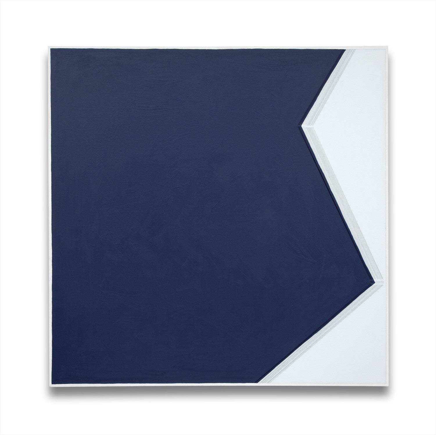 A blue and white painting on a white wall.