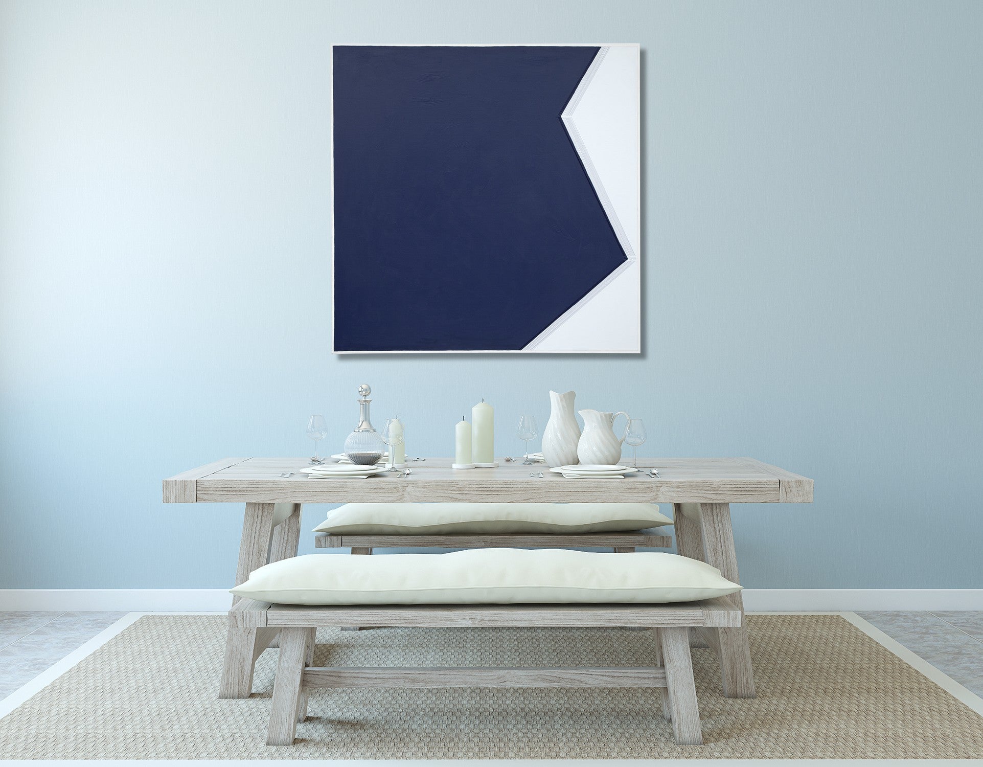 A blue and white painting on a white wall.