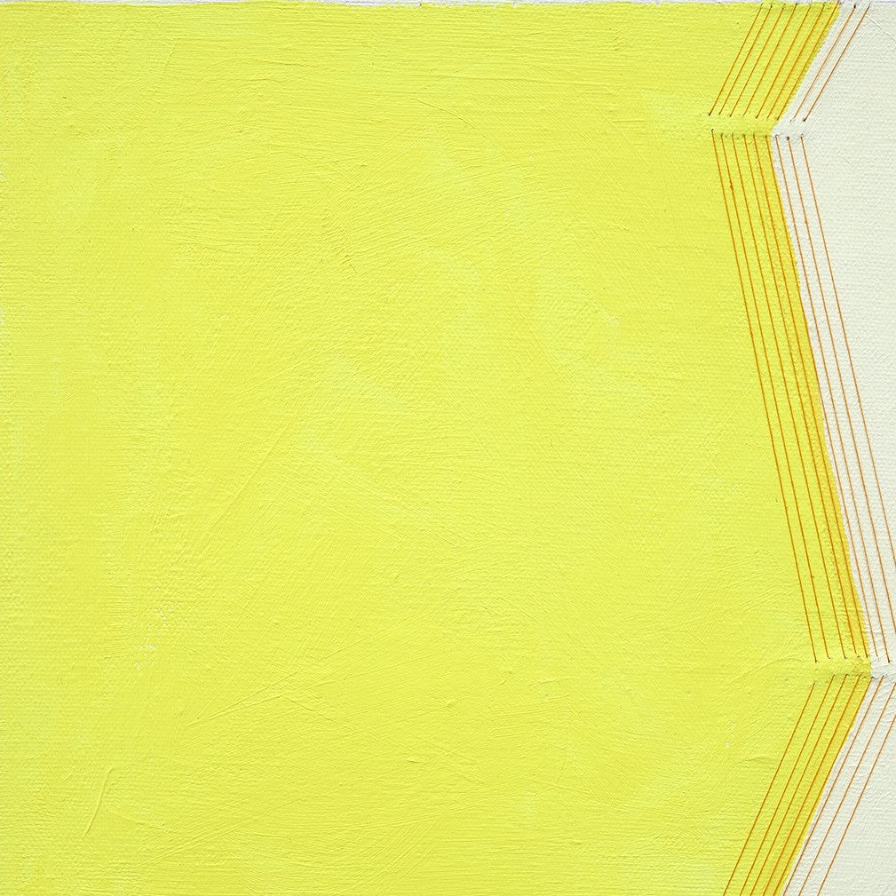 A yellow and white painting on a white wall.