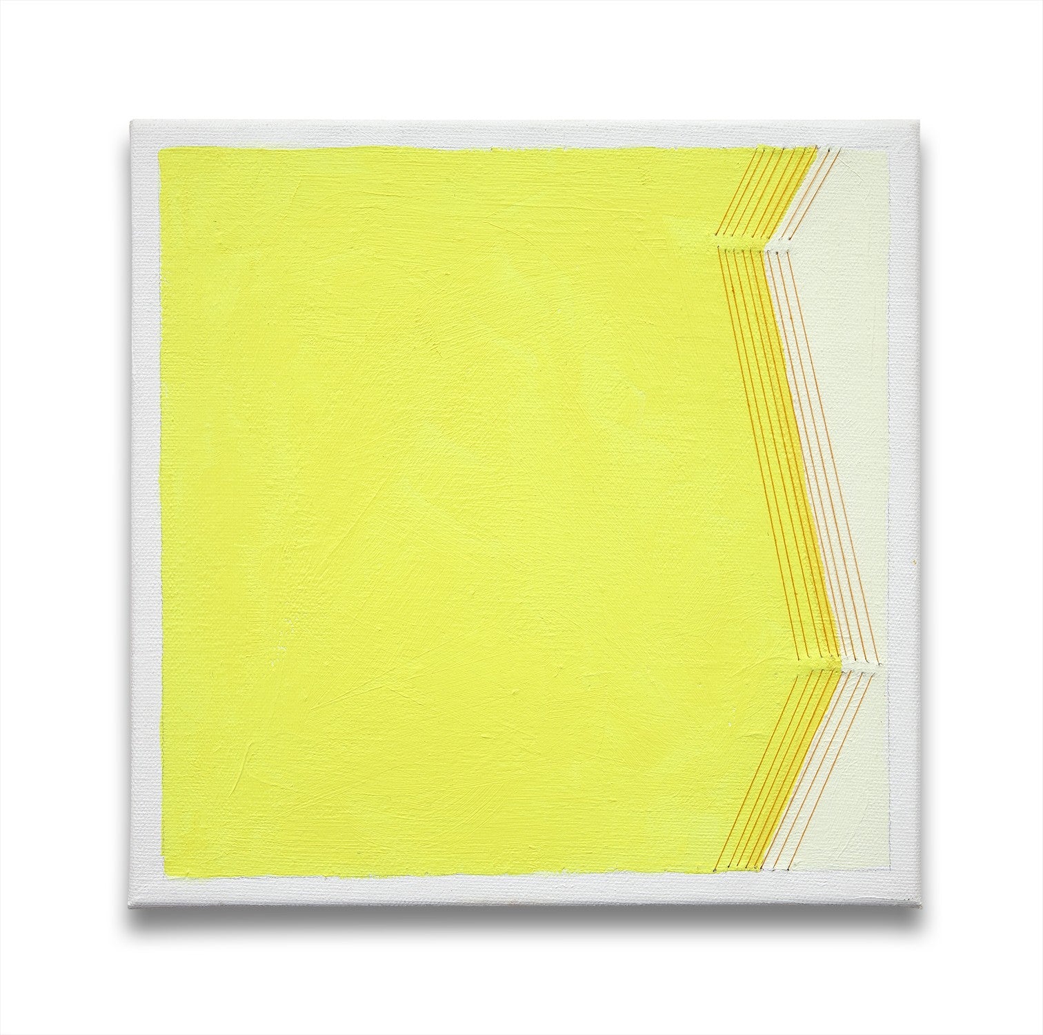 A yellow and white painting on a white wall.