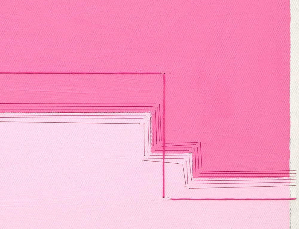 A pink square with a white border on a pink background.