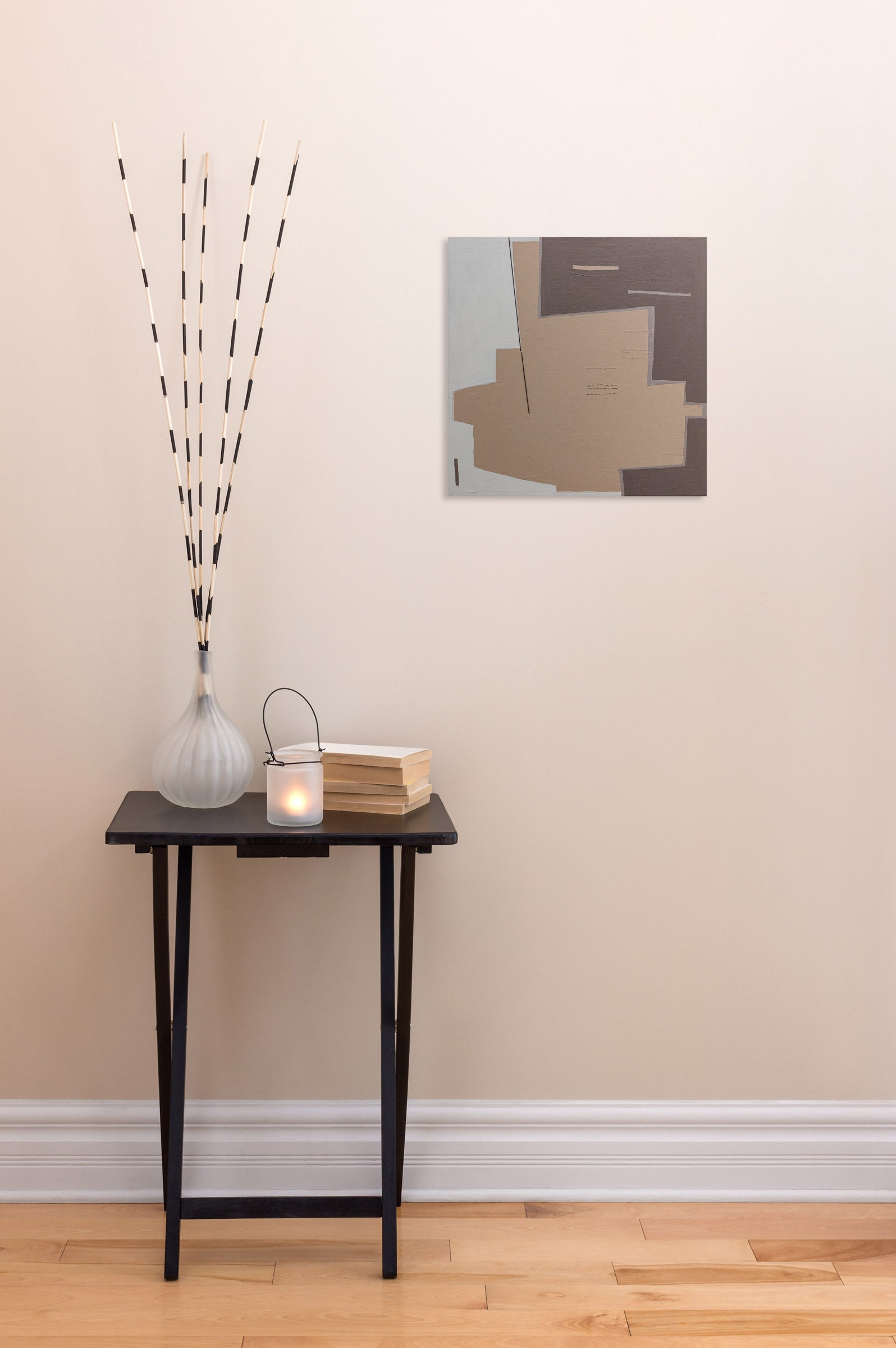 A painting on a white wall with a brown and white background.