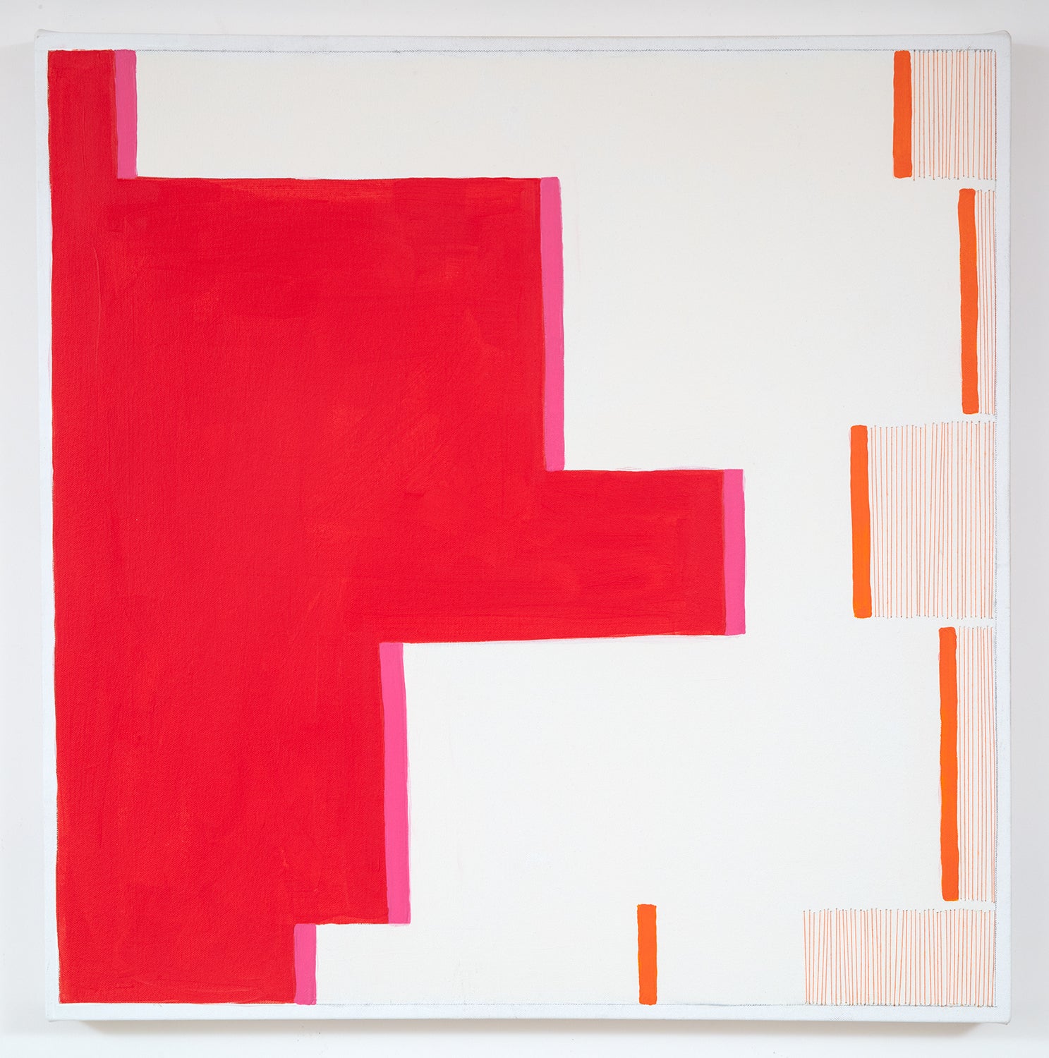 A painting on a white wall with a red and orange design.