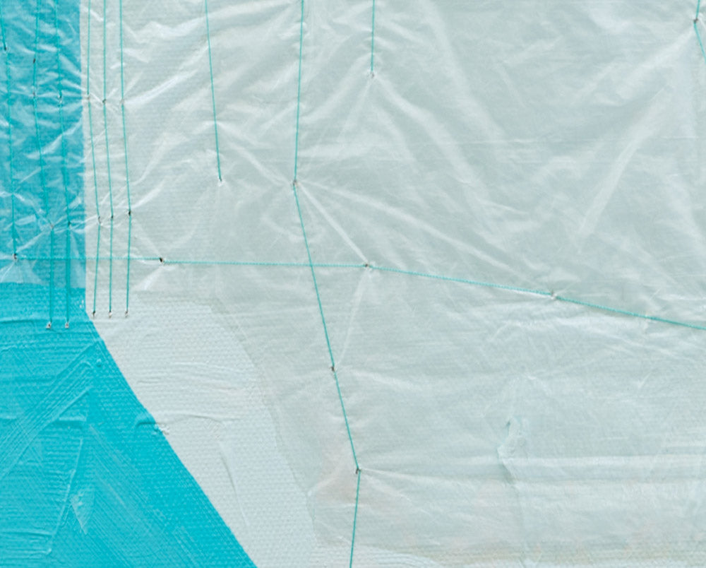 A piece of paper with a blue and white design on it.