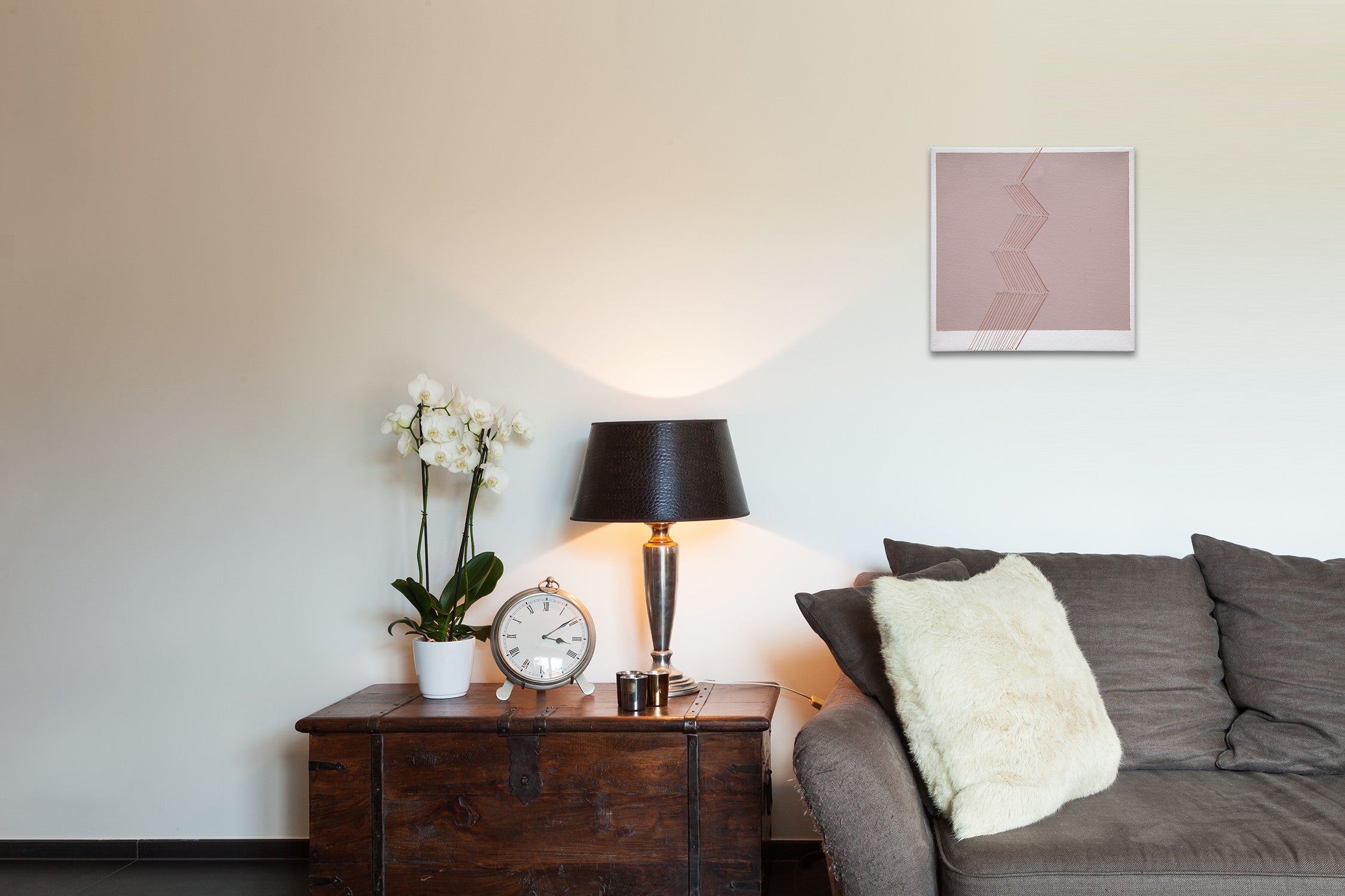 A pink and white painting with a line drawing on it.