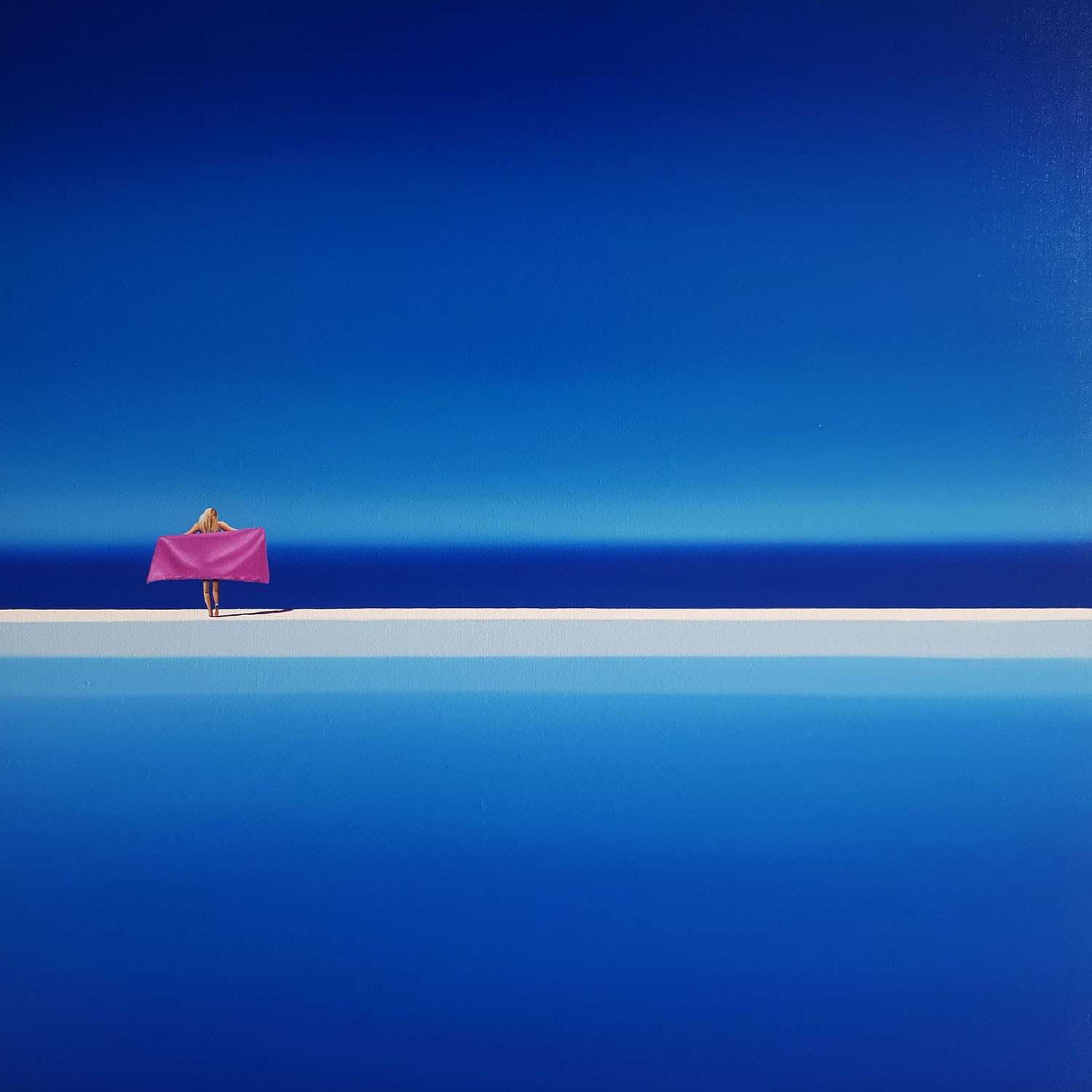 A person standing on top of a cliff with a pink umbrella.