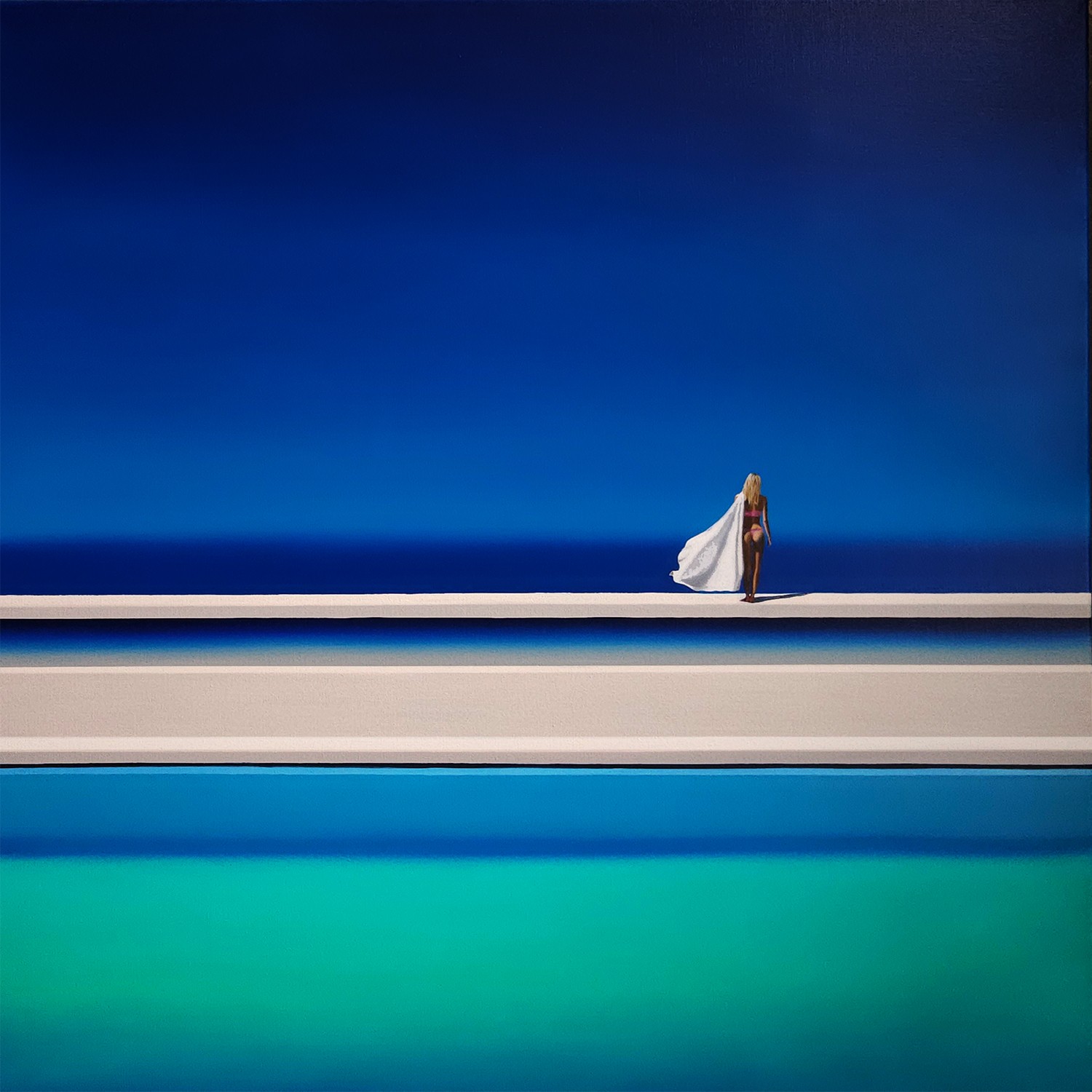 A woman standing on the edge of a swimming pool.