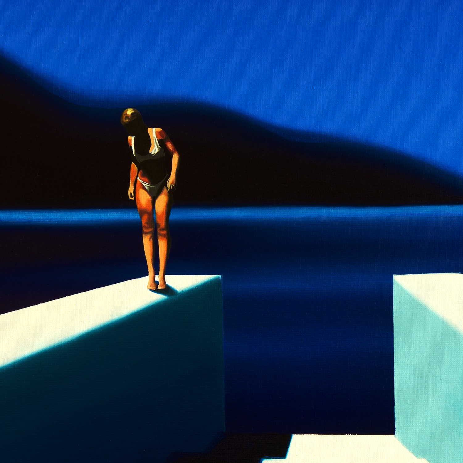 A solitary figure stands poised on a white block against a deep blue backdrop.