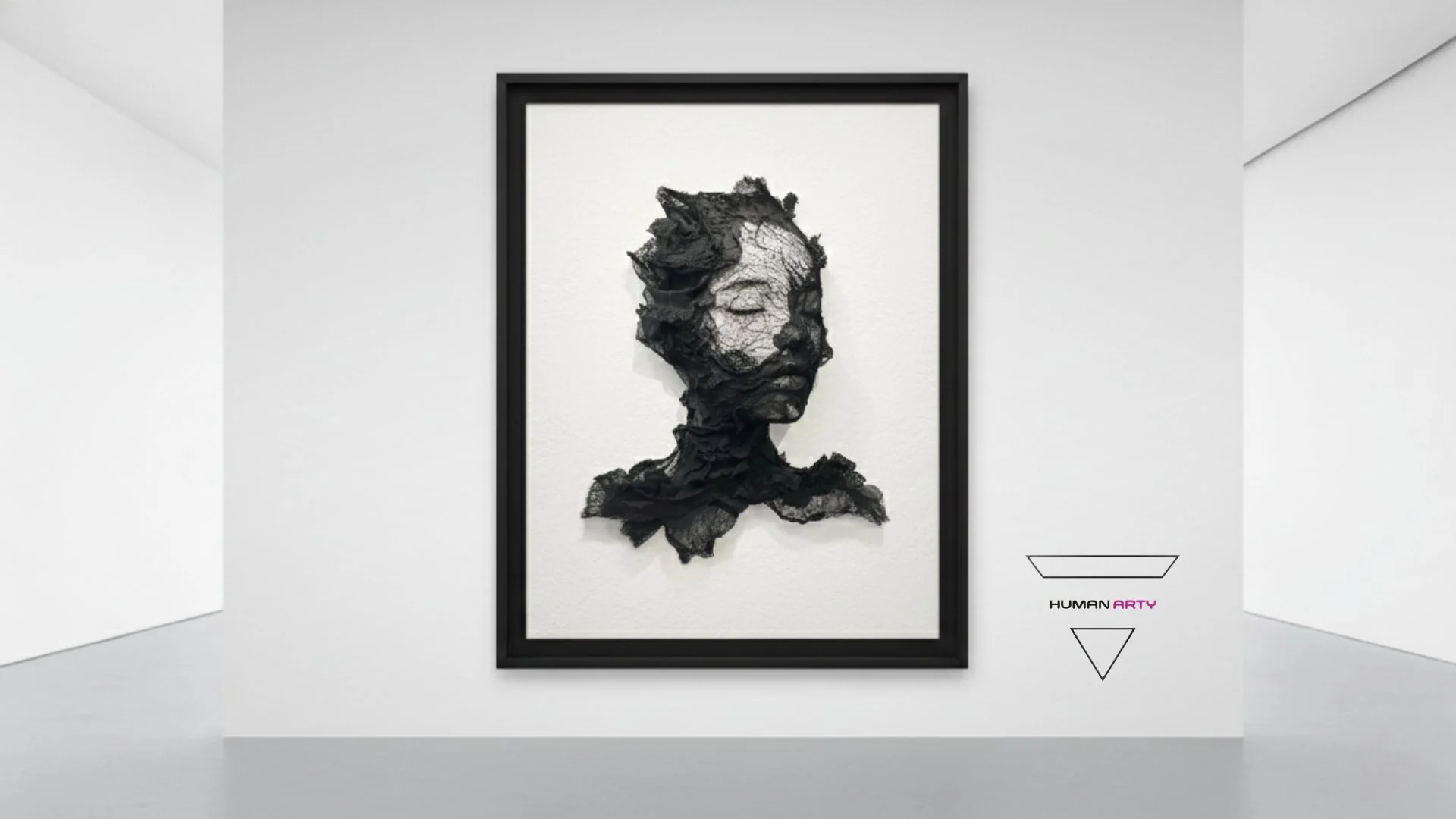 A monochromatic portrait of a sleeping figure constructed from textured black fabric against a stark white background.