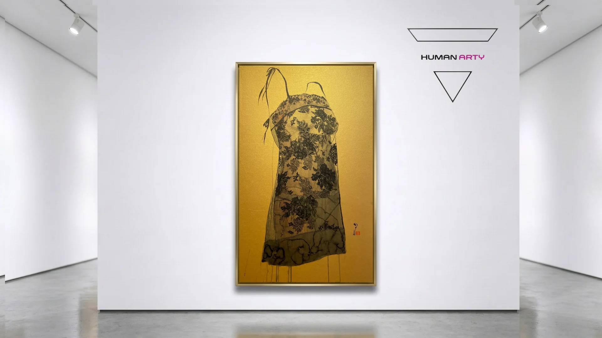 A framed artwork of a floral-patterned garment displayed in a gallery setting.