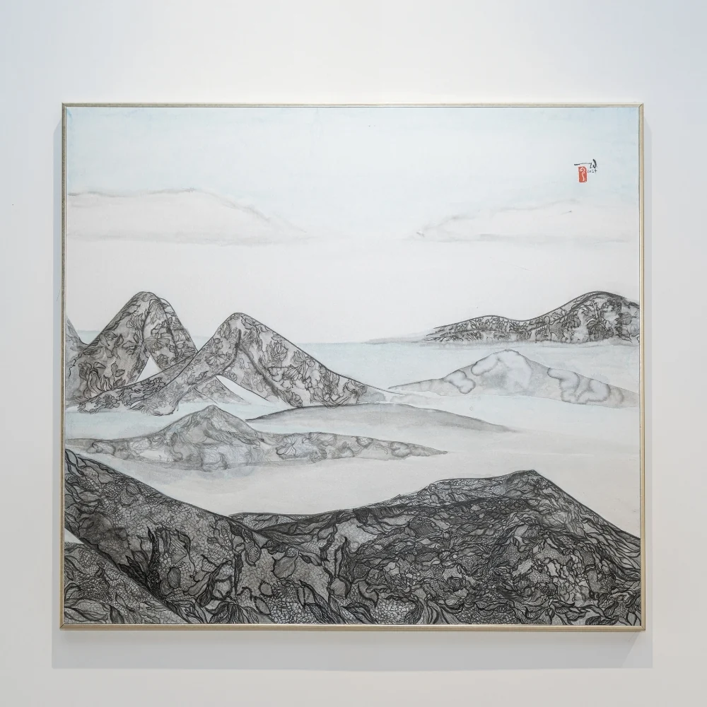 A minimalist ink landscape featuring layered mountains and misty valleys.