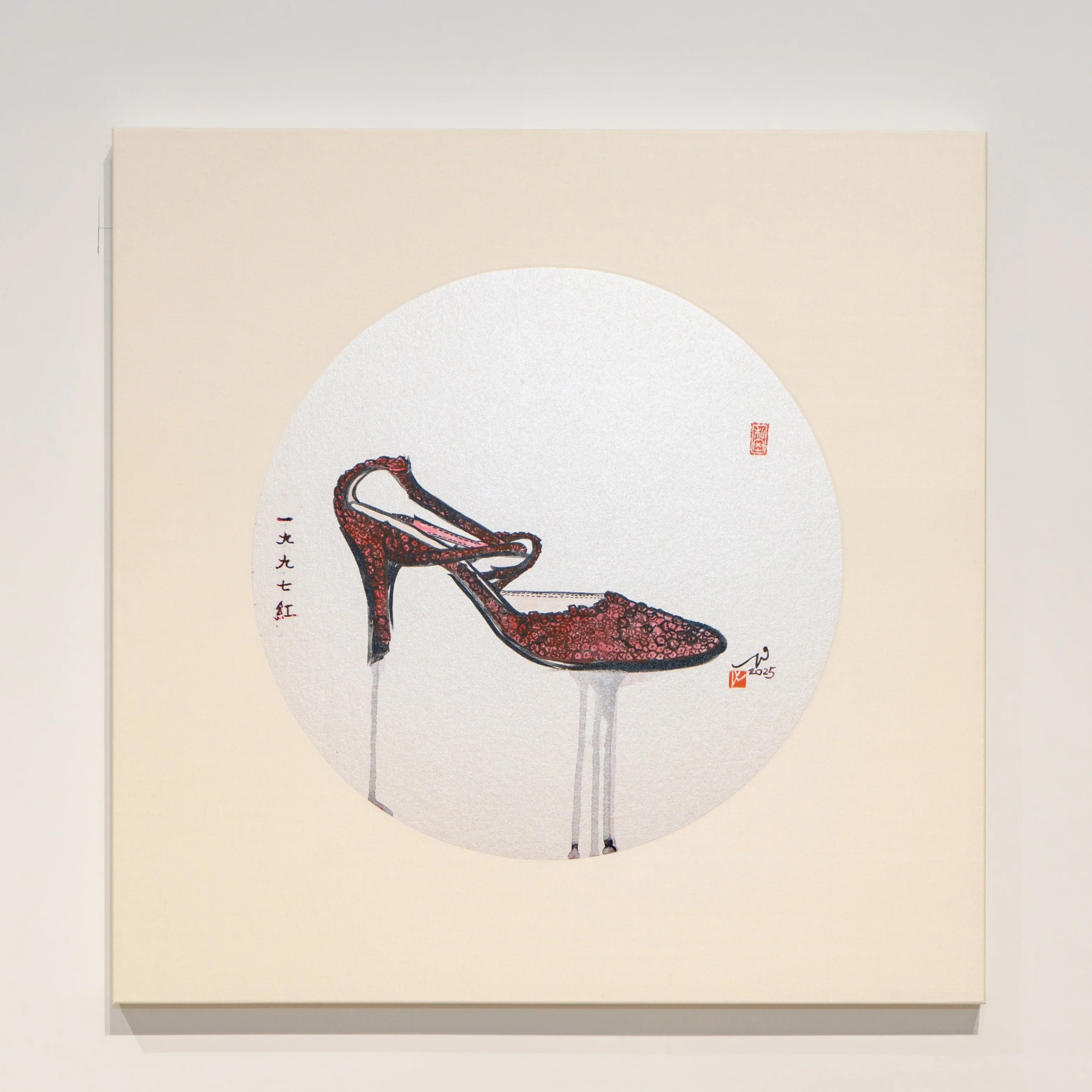 A minimalist gallery display featuring a square painting of a high-heeled shoe within a circle.