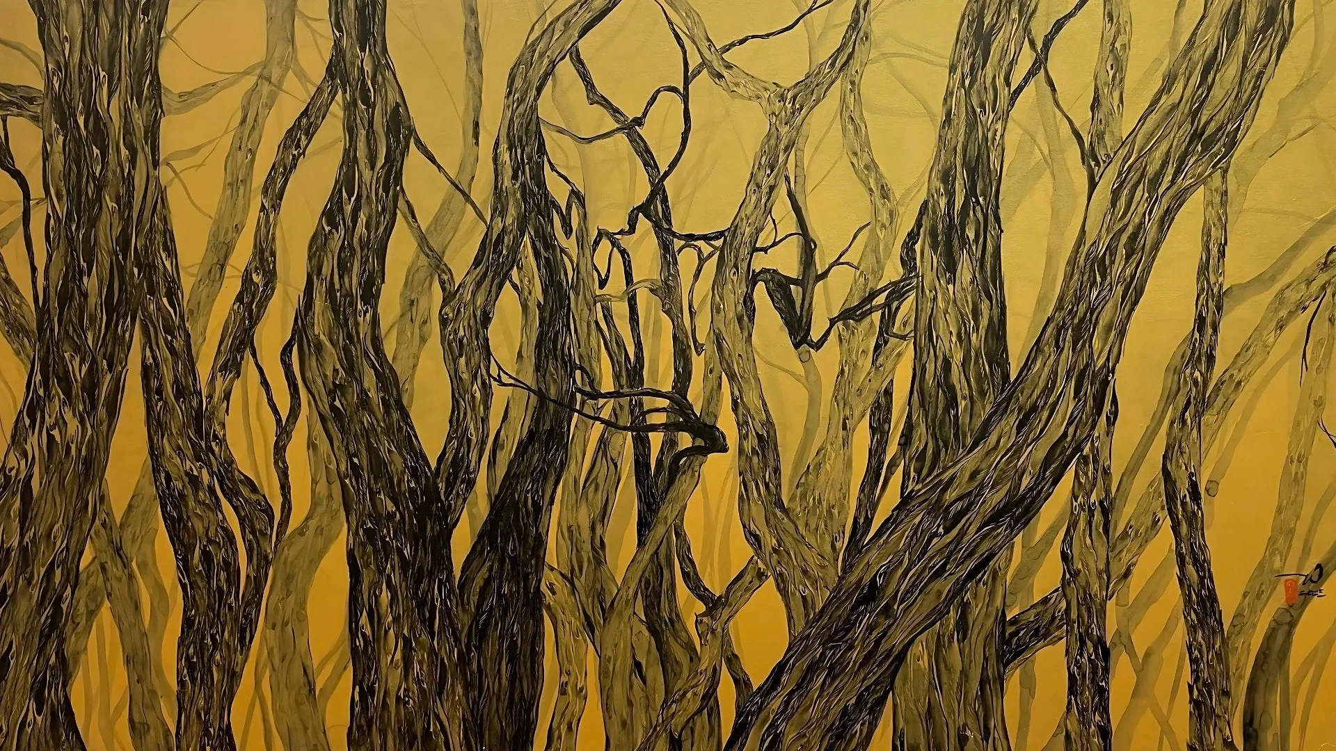 A dense forest of twisted, dark tree trunks set against a vibrant yellow background.