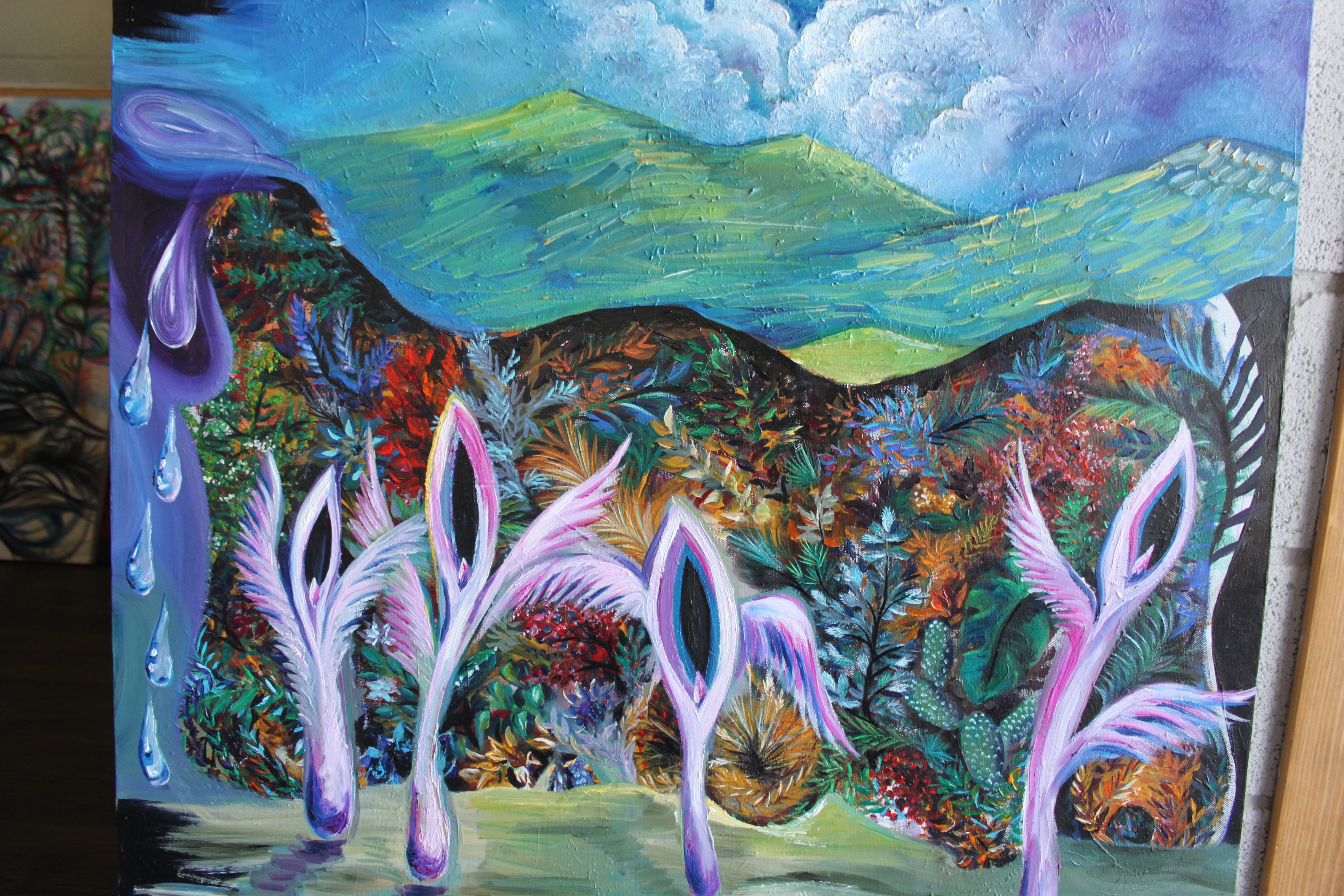 A vibrant landscape painting featuring purple stylized figures against a colorful, dreamlike background.
