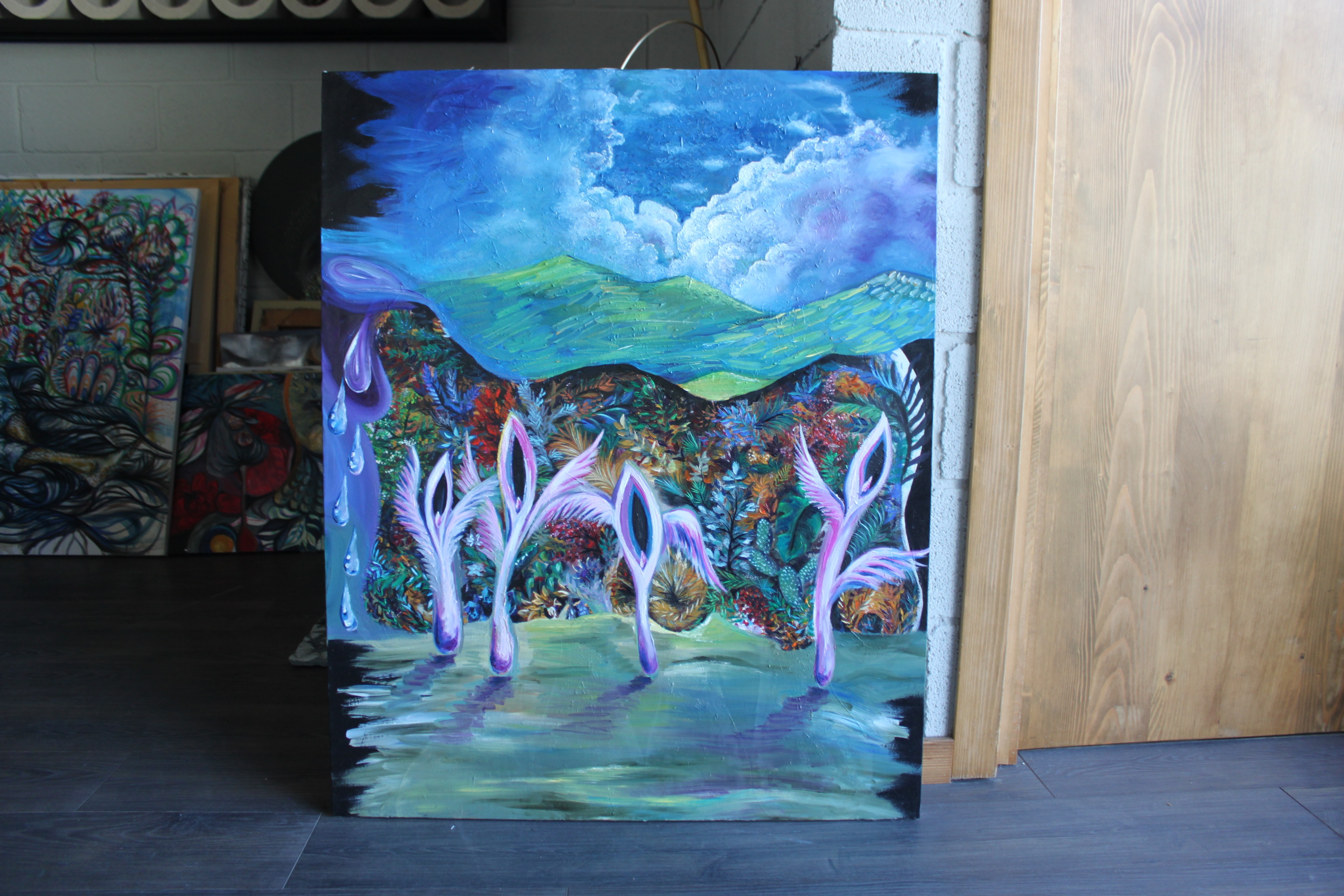 A vibrant landscape painting featuring purple stylized figures against a colorful, dreamlike background.