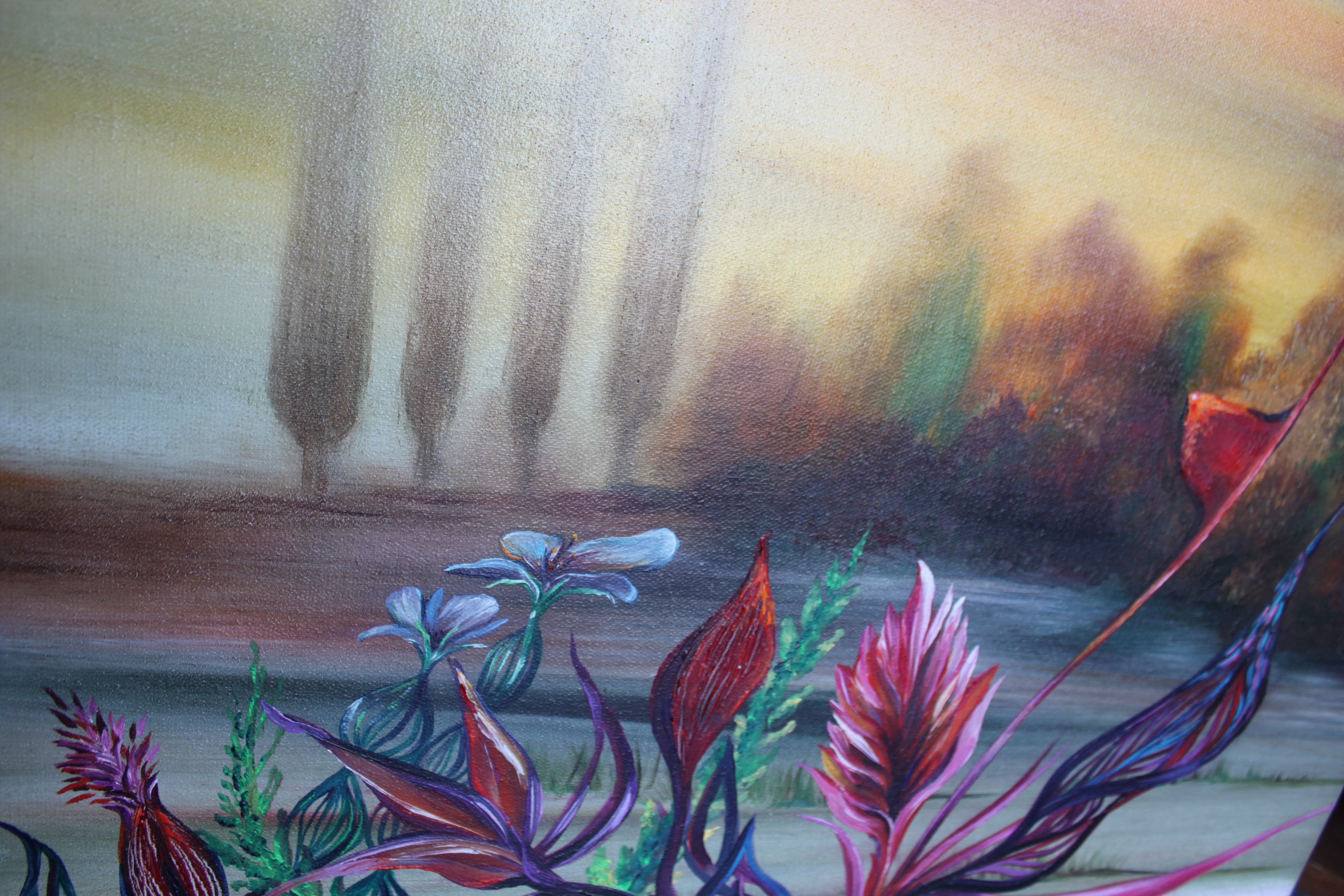A painting on a wooden table in front of a shelf.