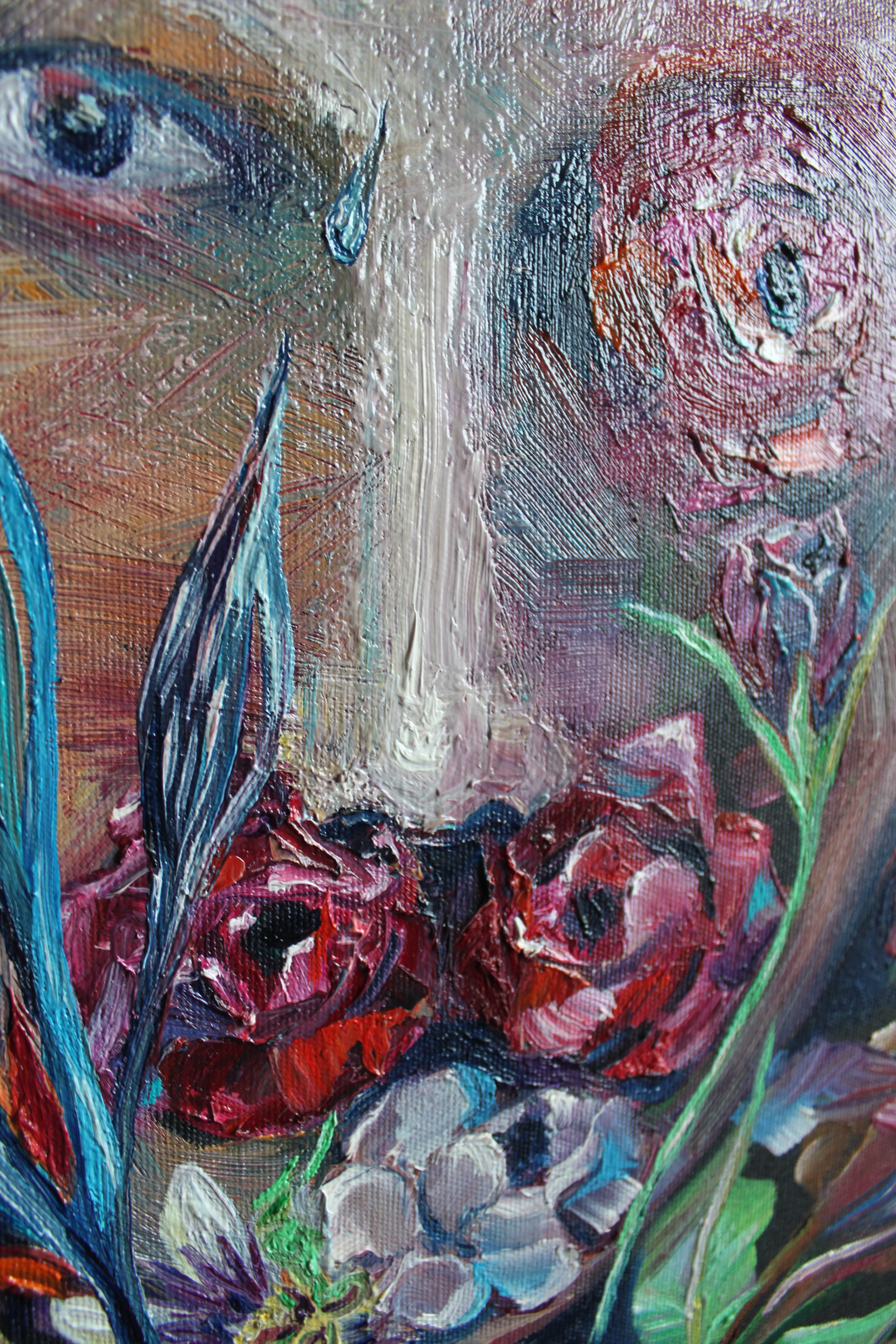 A painting of a woman's face on a wooden table.