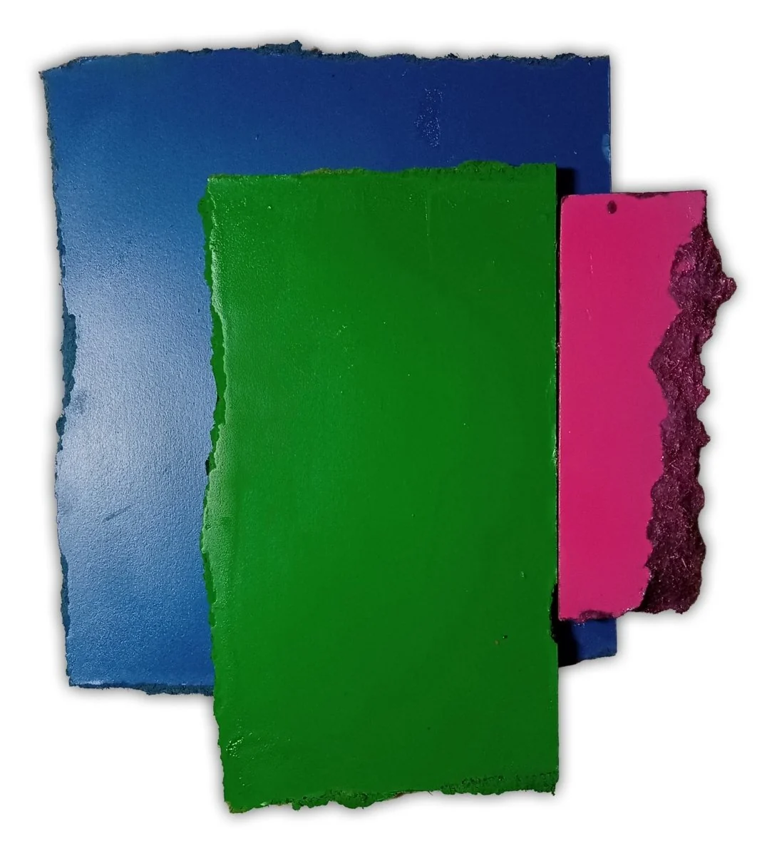 A layered composition of three rectangular paper sheets in blue, green, and pink against a white background.