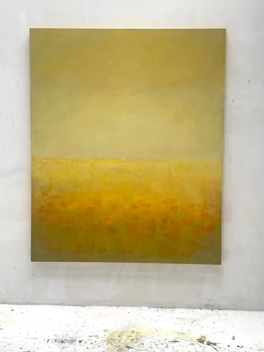 A serene landscape painting of a field of poppies under a vast, hazy sky.
