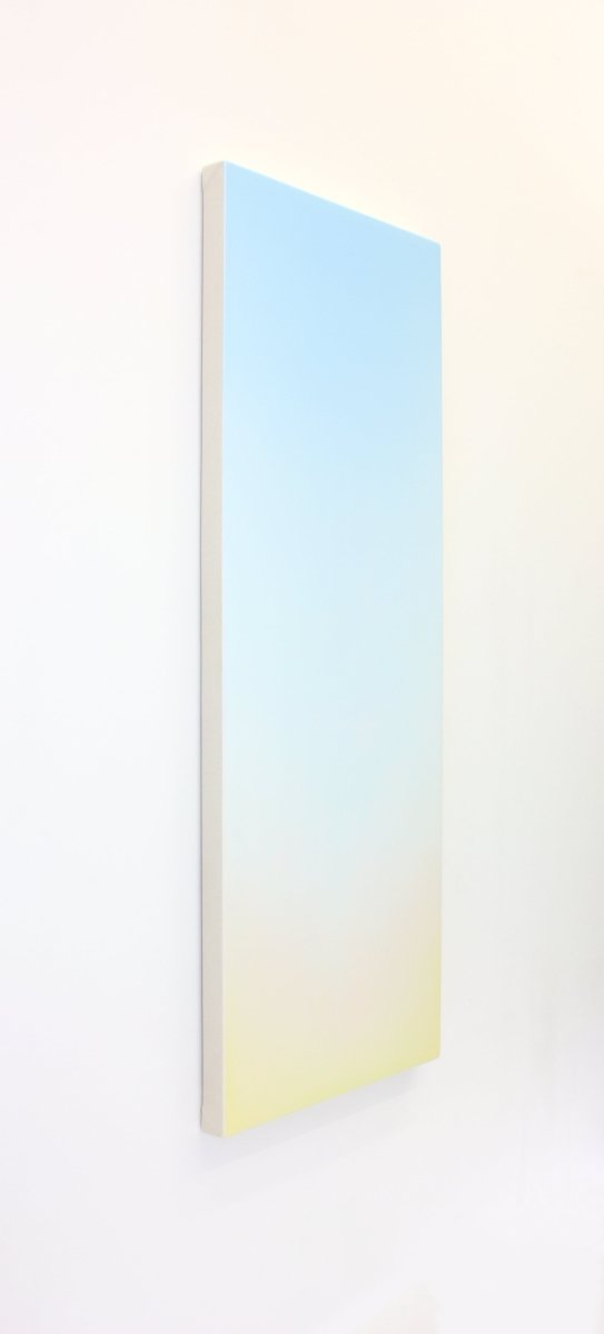 A minimalist vertical gradient artwork transitioning from pale blue to soft yellow.