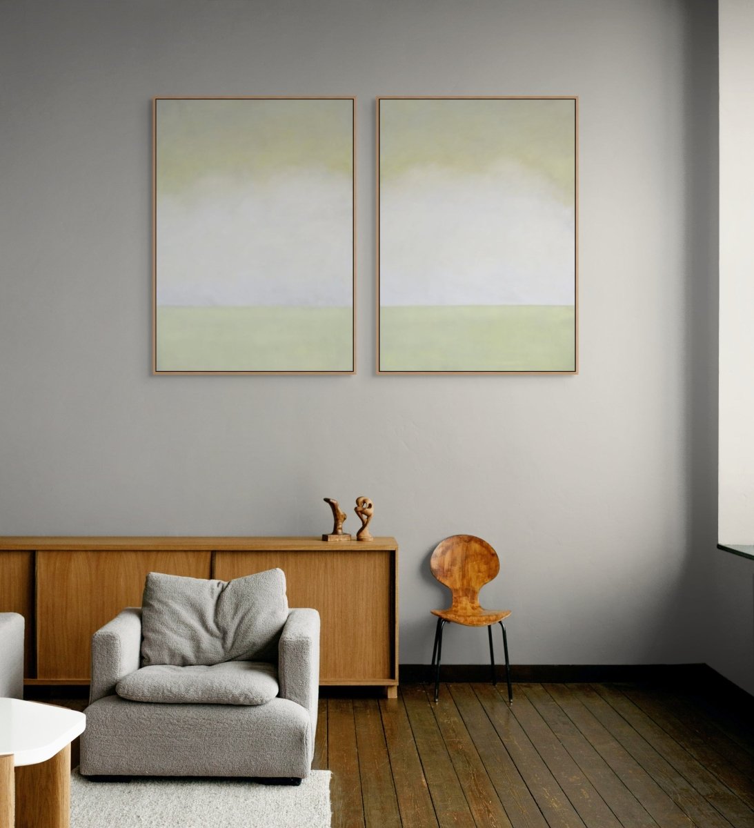 A diptych of abstract landscapes featuring soft gradients of pale yellow, white, and muted green.
