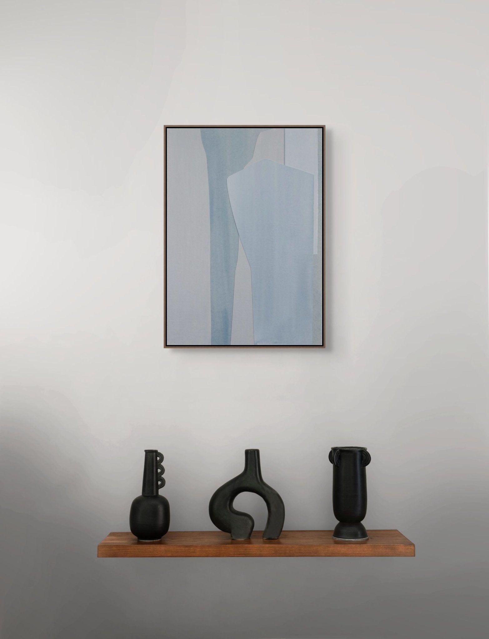 A minimalist abstract composition featuring layered geometric shapes in cool blue and grey tones.