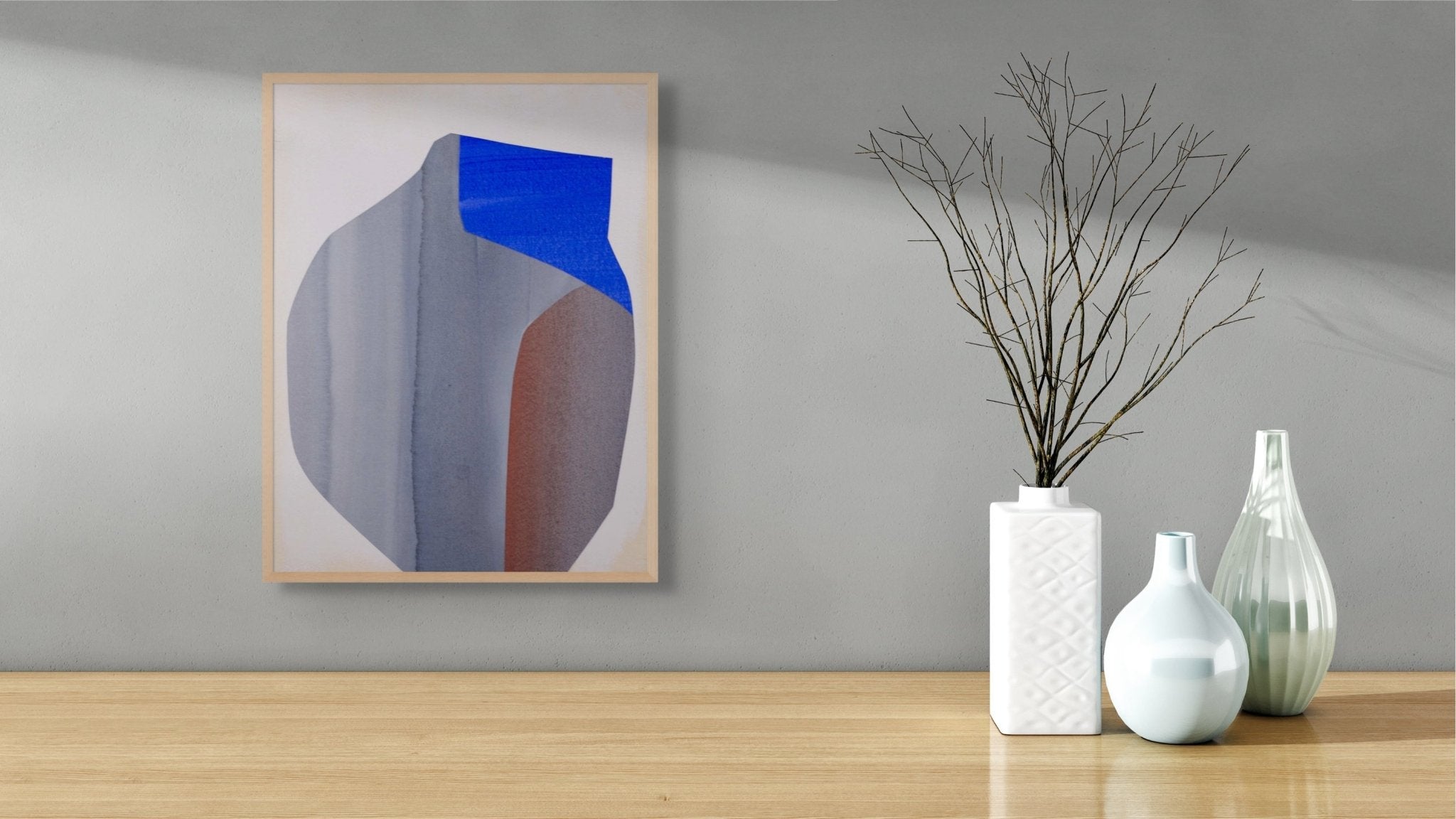 An abstract composition featuring a large, geometric form in muted blue and brown tones against a pale background.