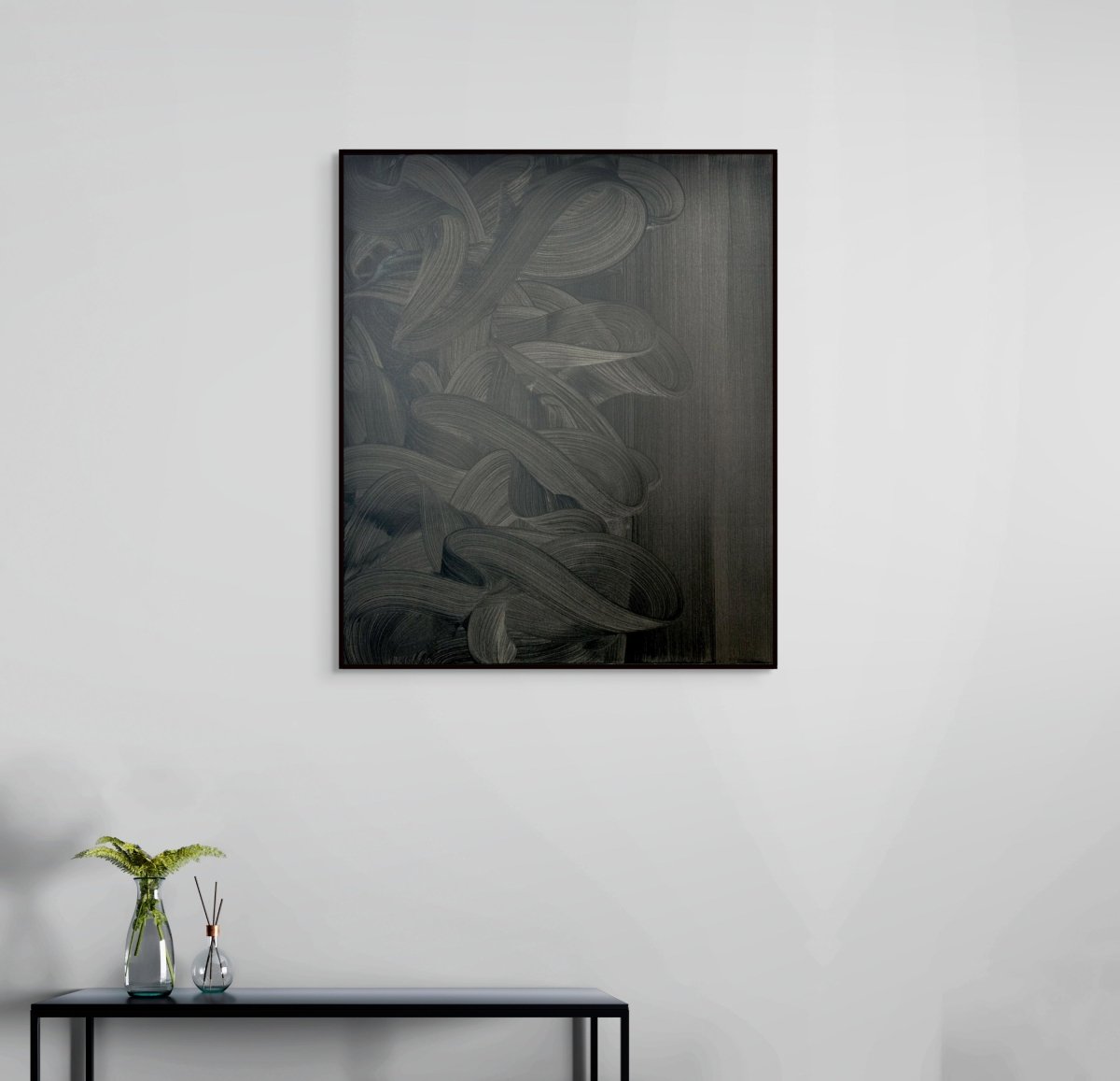 A monochromatic abstract composition featuring tangled ribbons against a textured background.