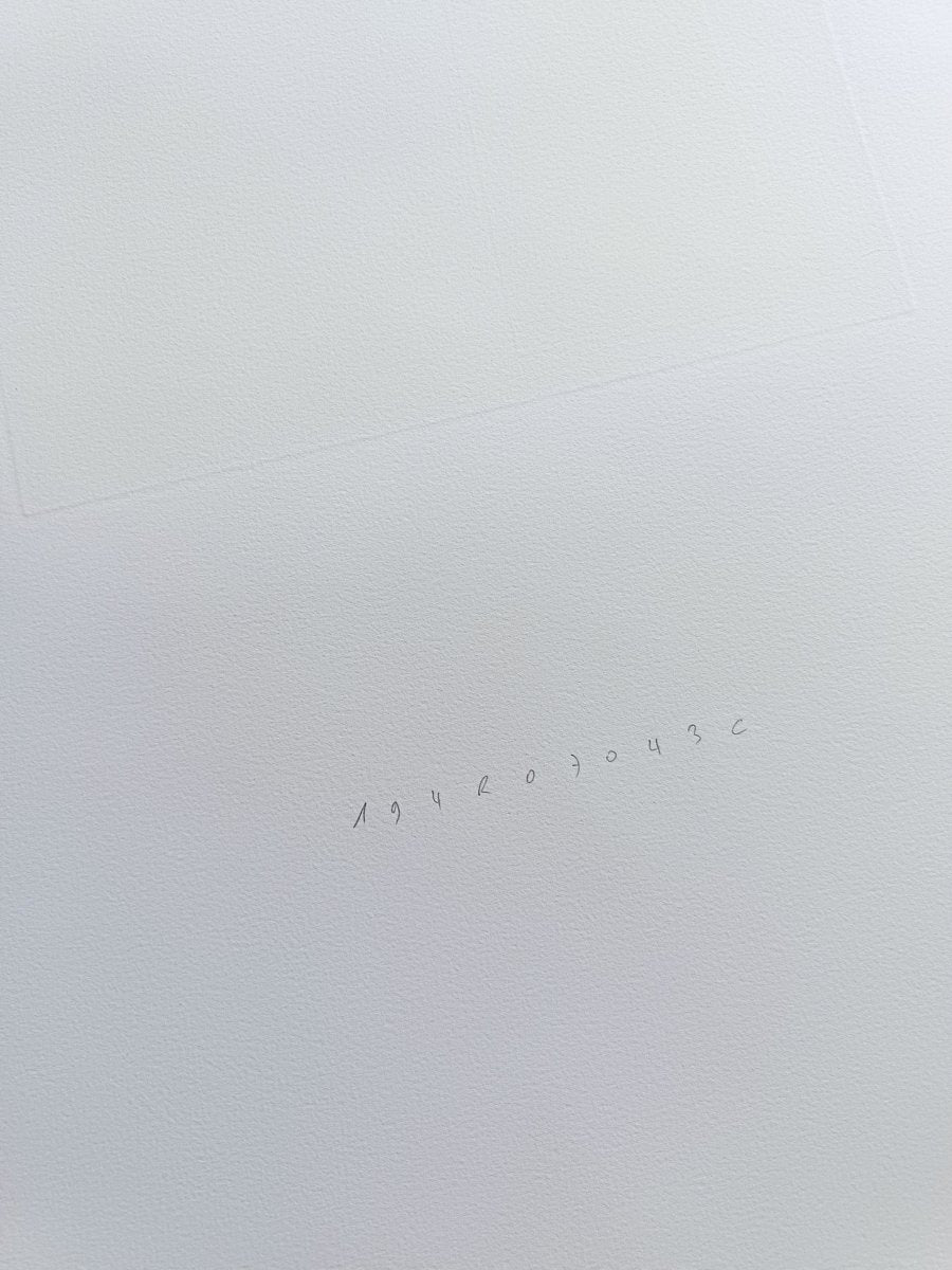 A triptych of minimalist abstract prints featuring dark geometric shapes on gray squares against white backgrounds.