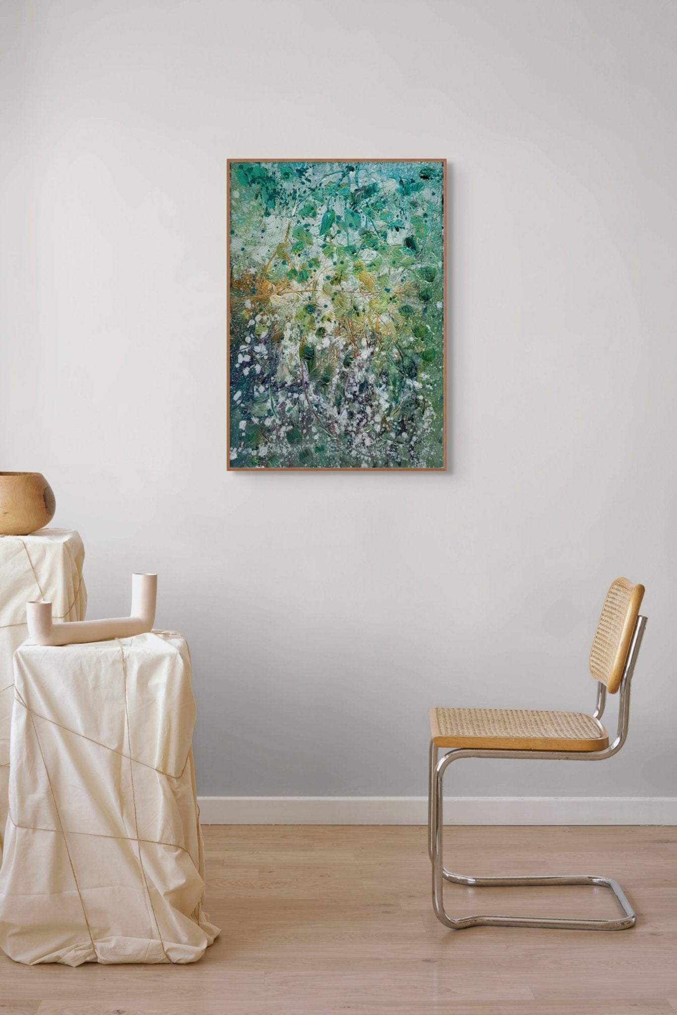 An abstract textured painting of tangled branches and foliage in a green and white palette.