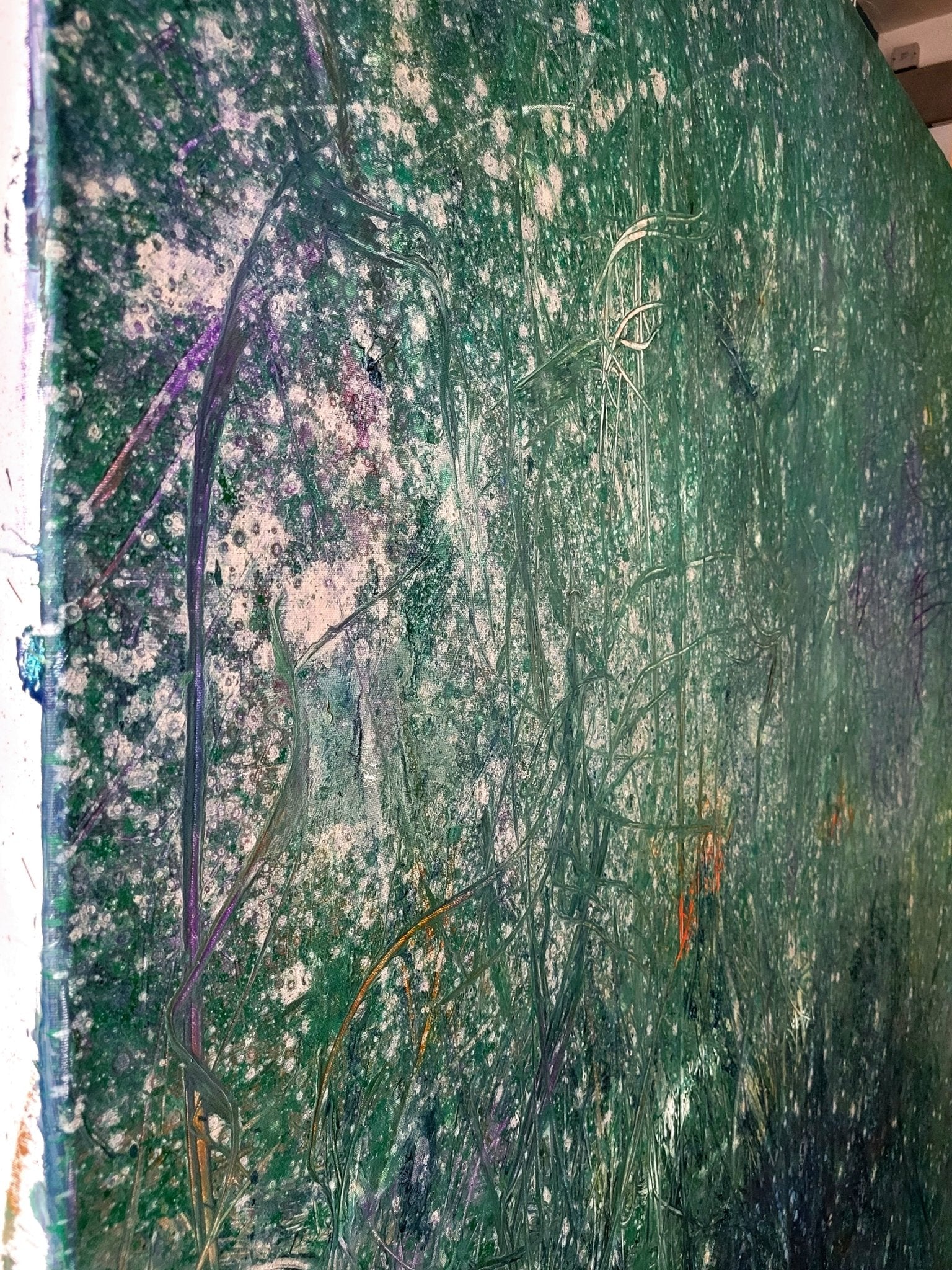 A textured abstract landscape featuring a dense field of tall grasses in cool greens and teals, punctuated by scattered white specks.