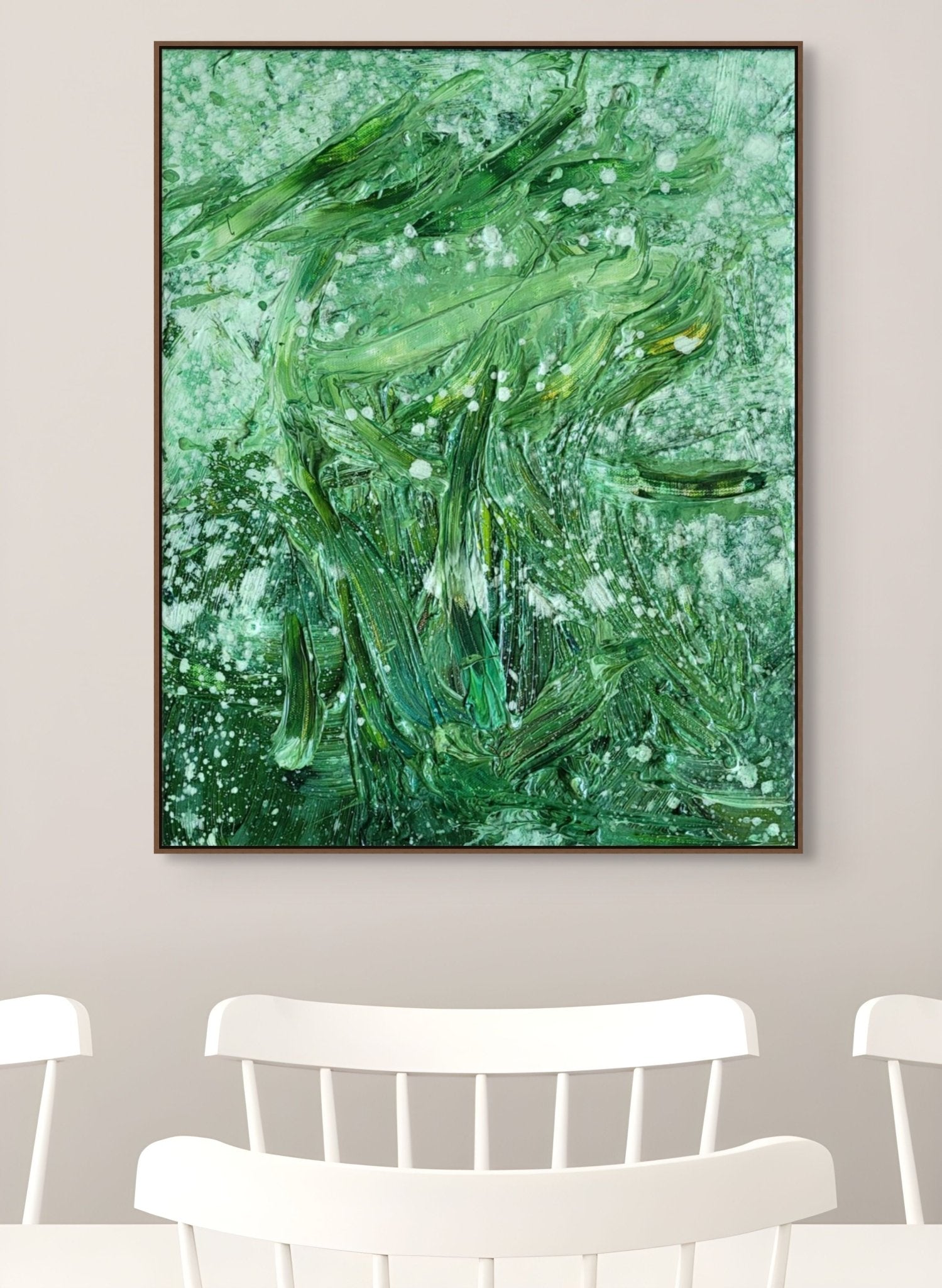 An abstract oil painting featuring a face formed by thick green brushstrokes and white splatters.
