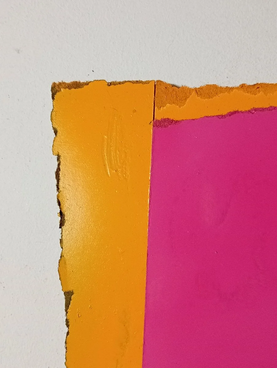 A layered abstract composition featuring a textured orange frame surrounding a smooth magenta rectangle.