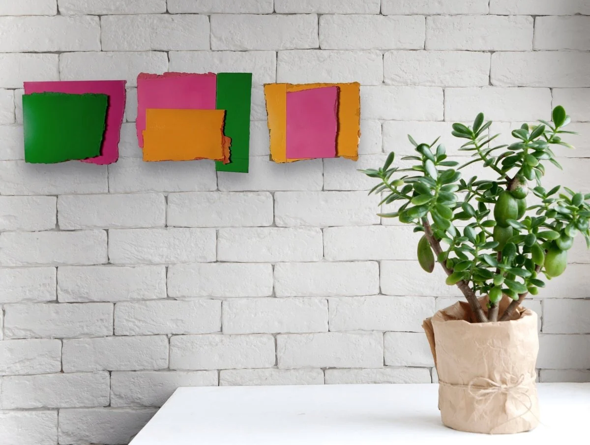 A layered abstract composition featuring a textured orange frame surrounding a smooth magenta rectangle.