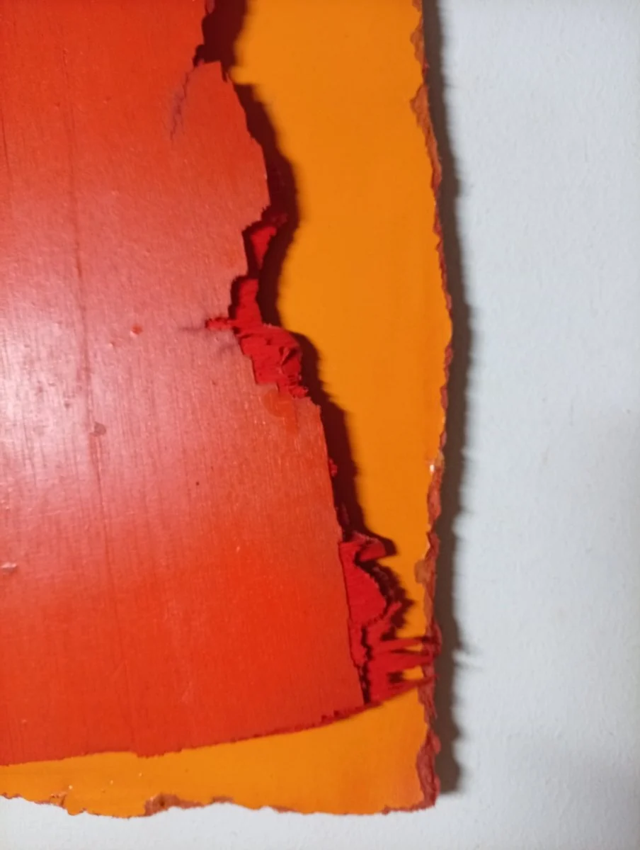 A layered abstract composition of three textured rectangular panels in bold primary colors.