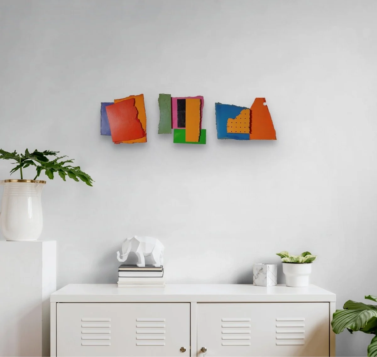 A colorful abstract composition of layered rectangular blocks with torn edges.