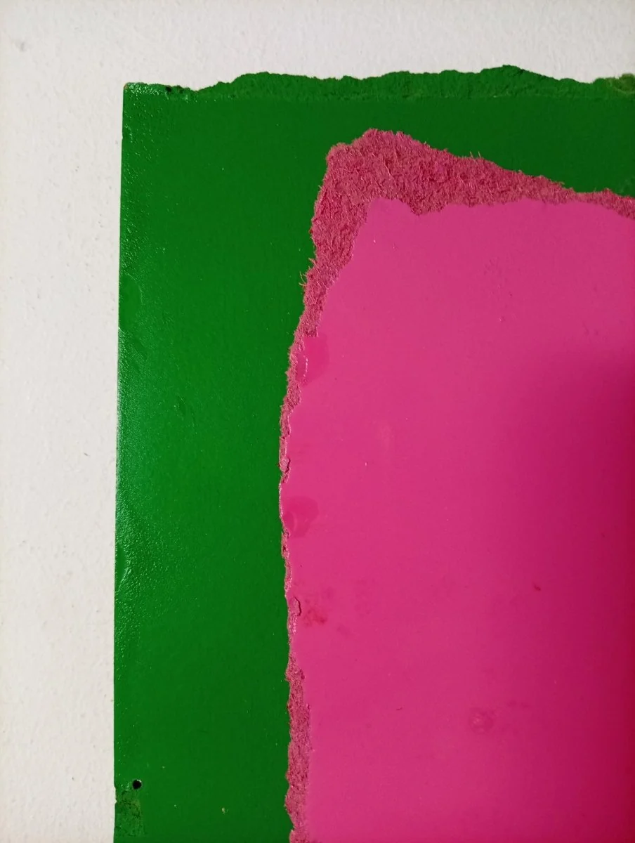 A layered abstract composition featuring a rough-edged pink square over a green background.