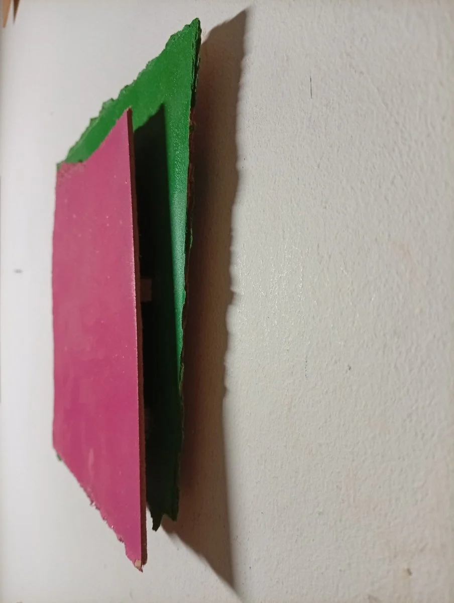 A layered abstract composition featuring a rough-edged pink square over a green background.