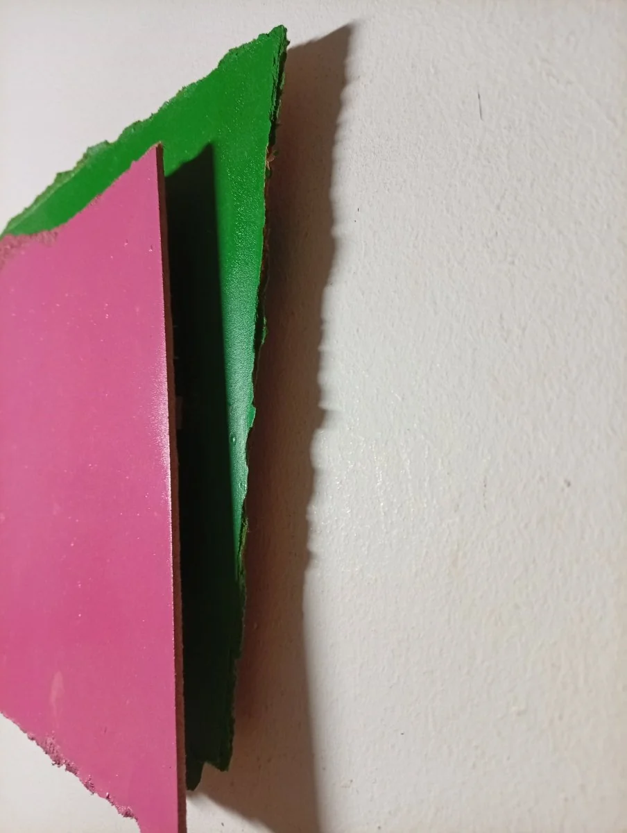 A layered abstract composition featuring a rough-edged pink square over a green background.