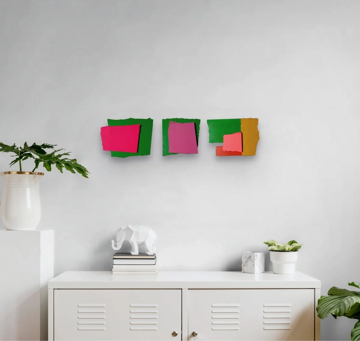 A colorful abstract composition of four painted paper fragments arranged in a grid.