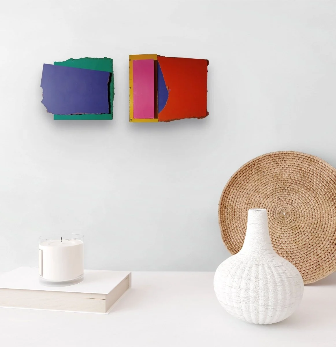 A layered composition of torn paper pieces in deep blue and forest green.
