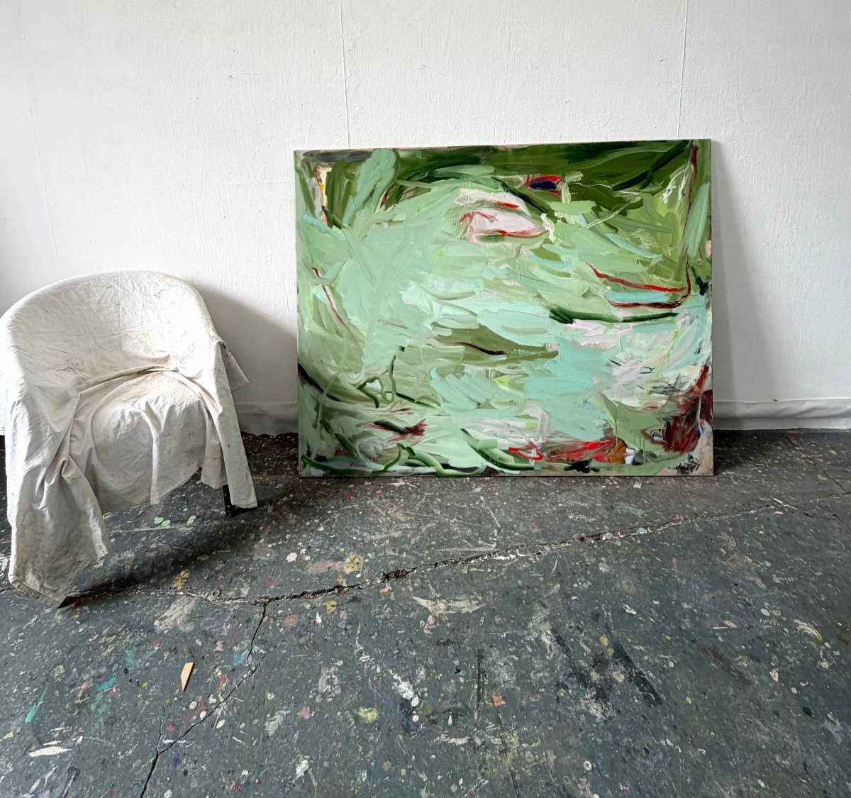 An abstract expressionist painting featuring a chaotic, layered composition of green and white strokes with sharp red accents.